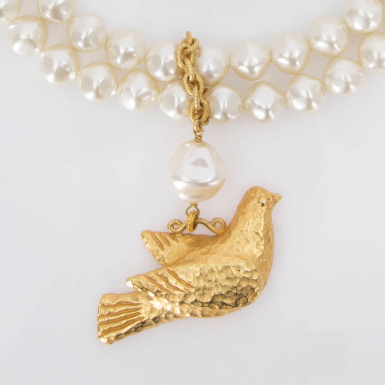 Gorgeous DOMINIQUE AURIENTIS of Paris two strand Baroque Faux Pearl Choker Necklace suspending Gold tone Bird Pendant; the pearls are creamy and smooth, and the secure closer is a crossbar and loop. Approx. 15