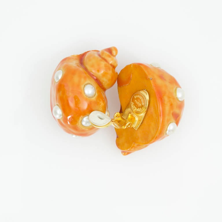 Beautiful Pair of Dominique Aurientis Orange Enamel on Resin Faux Pearl Shell Clip Earrings; the Dominique Aurientis Paris signature is on the back.  Approx. Size: 1.5