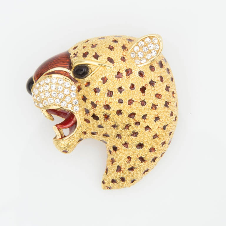 Featuring an amazing Leopard Pin and clip Earrings, gold tone with red and black enameled spots, the Leopard is enhanced with sparkling ice rhinestones and a black cabochon eye. One earring has red spots and the other earring has black spots; pin
