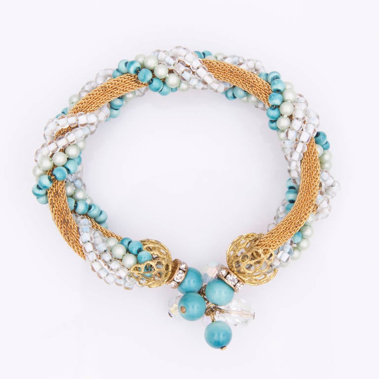 Fabulous Mid Century Modern Hobe Wrap Bracelet and matching Earrings; the bracelet features Faux Turquoise, Crystal and Rhinestone rondelles with gold tone mesh and end caps strung on memory wire. The matching clip earrings set with crystals and