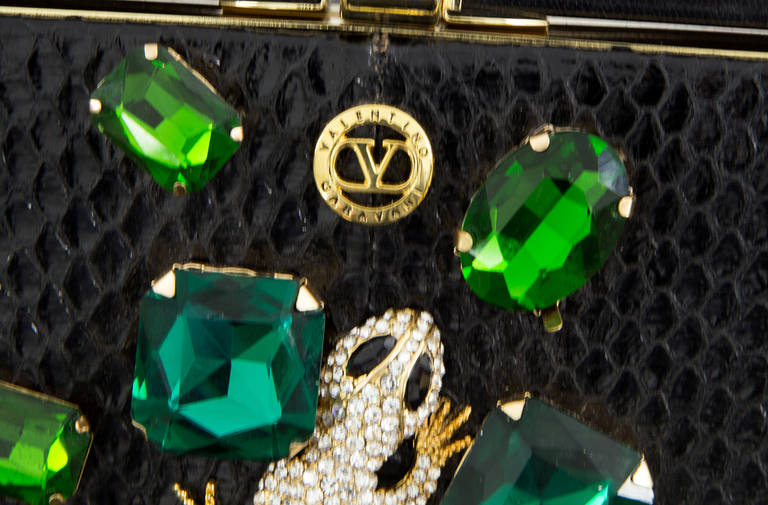 VALENTINO GARAVANI Haute Couture Black Python Clutch Bag with extraordinary jewel applications featuring a lizard completely encrusted with cut diamond like Swarovski stones and surrounded by large various cut Swarovski crystals in shades of green;