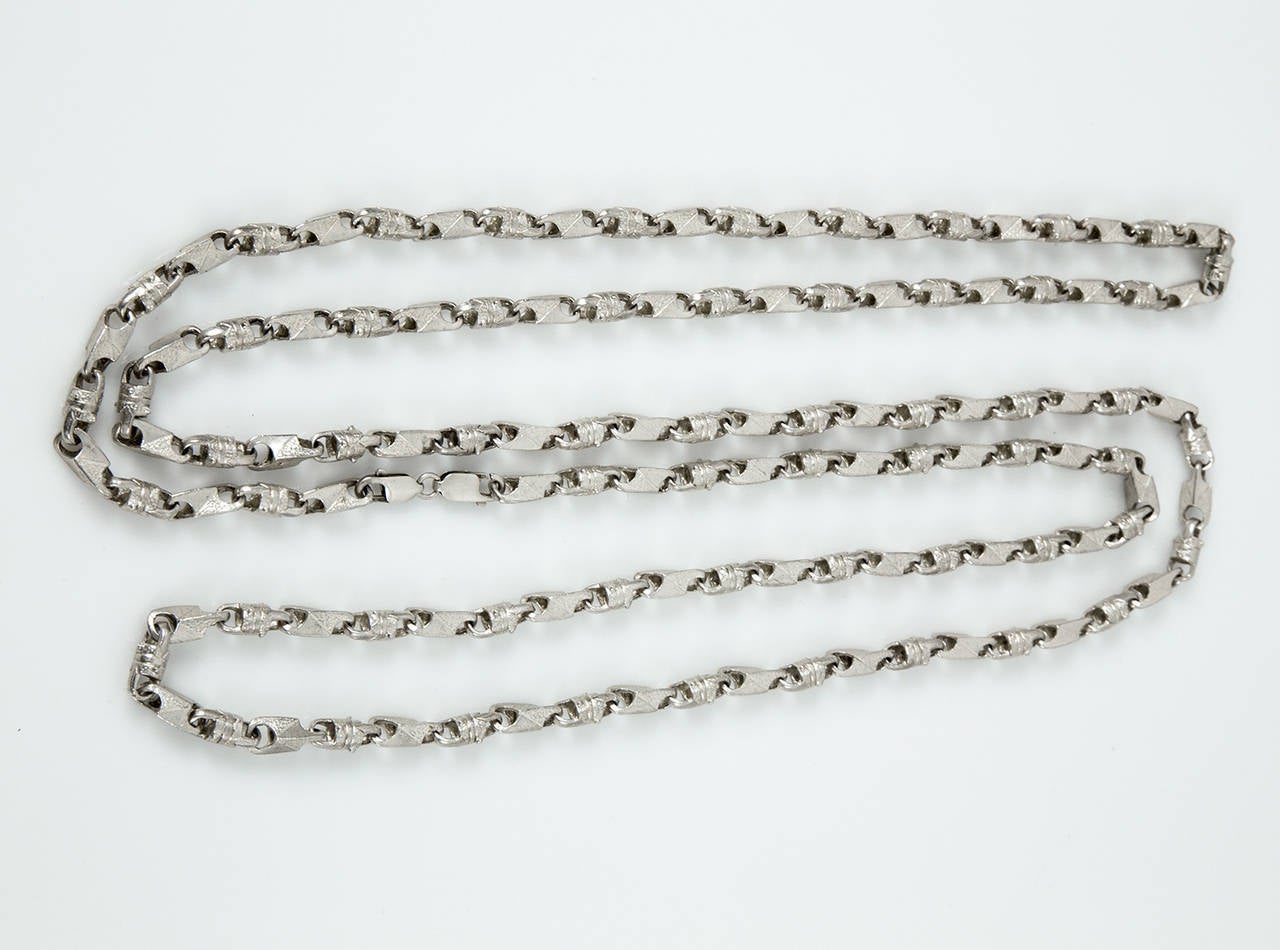 Unique and Dynamic Industrial-style links; so Versatile, can be worn very long single, doubled or tripled for a shorter look. Or suspend a watch, locket or pendant; measuring approx. 57.5” long; weighing approx. 122.4gm. C1960s