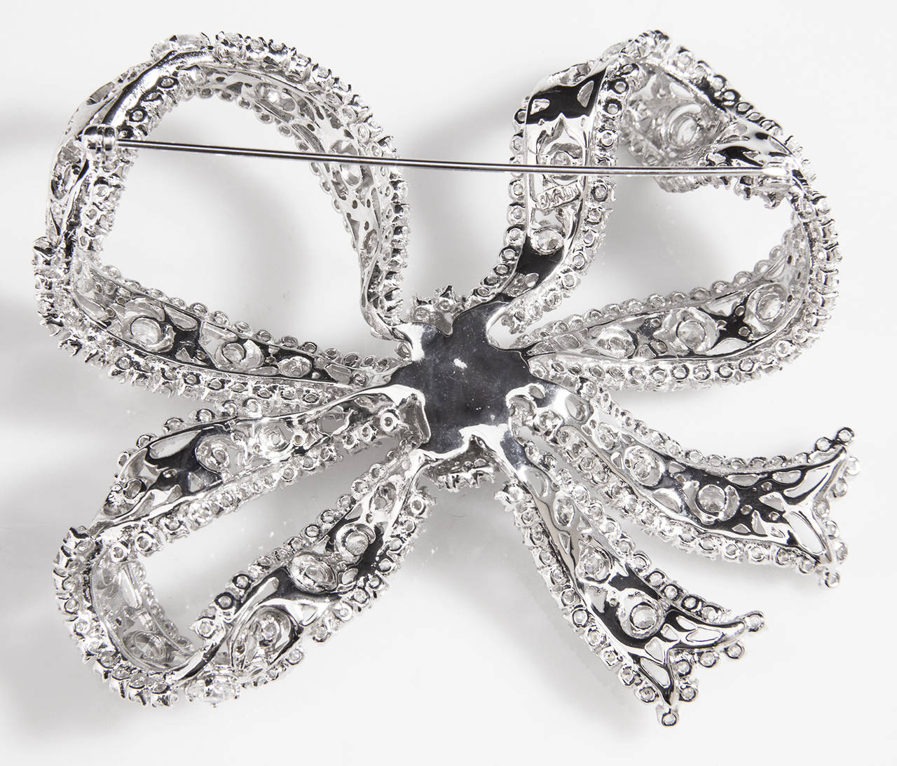 Gorgeous Designer Glittering Furled Bow Pin encrusted with sparkling CZ stones; approx. size: 3.5” x 3”. Brilliantly Made...Beautiful and unique as you are!