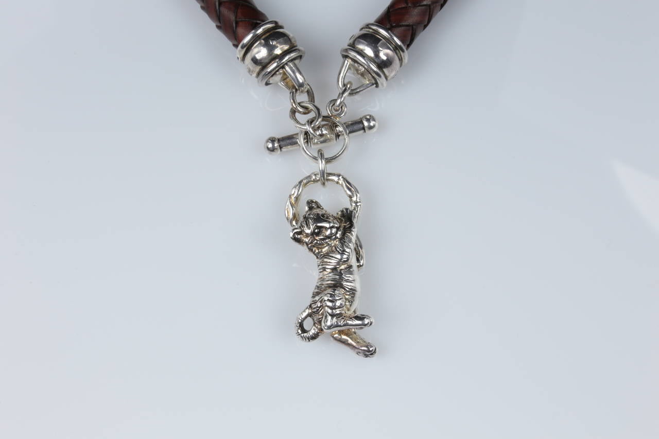 Featuring a Wonderful Sterling Silver Tiger Cub Cat, on a thick braided brown leather choker necklace,signed BKC; approx. 17.5
