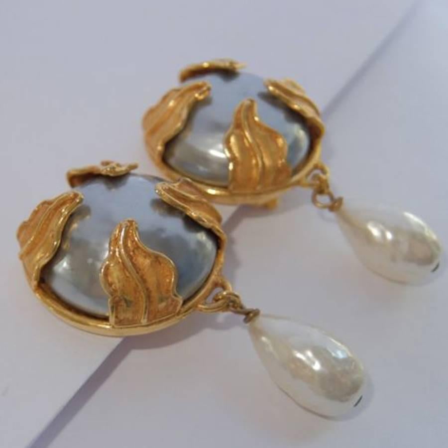 Beautiful pair of Vintage Couture Clip Earrings by Dominique Aurientis of Paris, featuring Gray Faux Mabe Pearls at top accented by Gold Gilt Leaves, suspending White Faux Baroque Pearl Drops.  Each measures approx 2.25