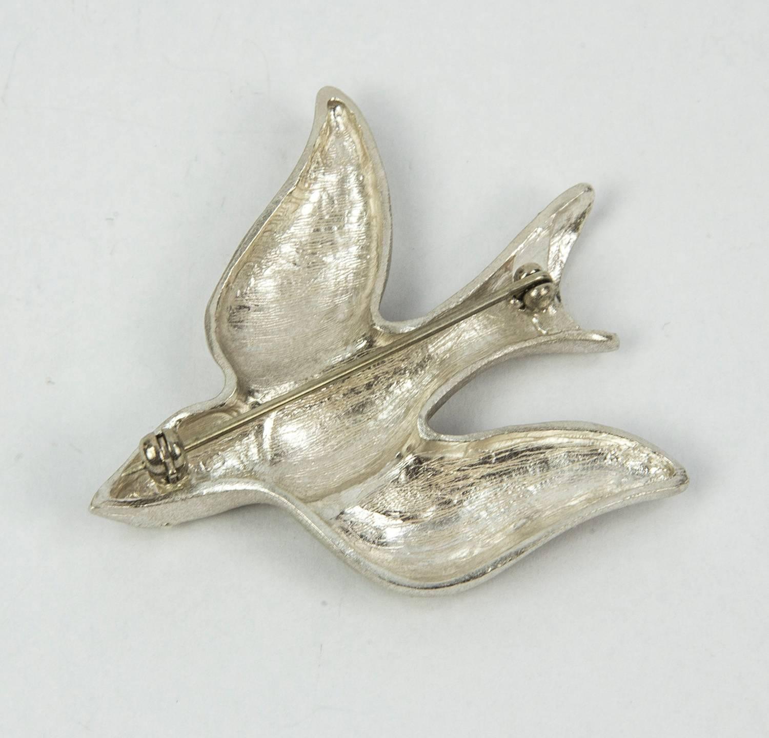Exquisite Dove of Peace brooch with brushed finish. Beautifully crafted in Solid Sterling Silver; 1.75” x 1.5”. The perfect accessory for day or night! 
