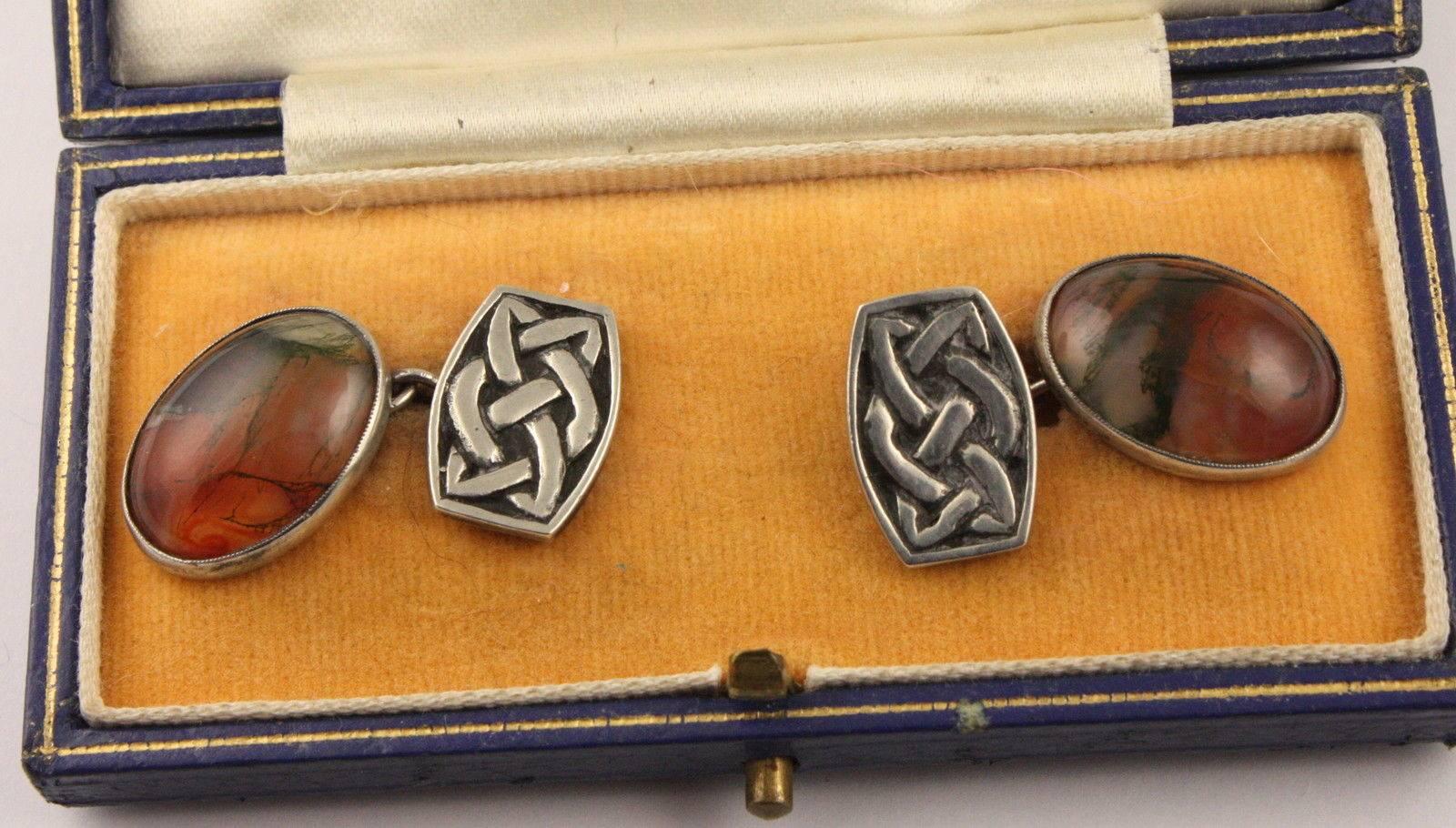 Classic pair of John Hart Scottish Iona Sterling Silver Scottish Moss Agate and Celtic knot design Cuff links in original box. The links have John Hart’s monograms on the back and silver stamps. Circa 1960s; sold by  prestigious Mappin & Webb Ltd.