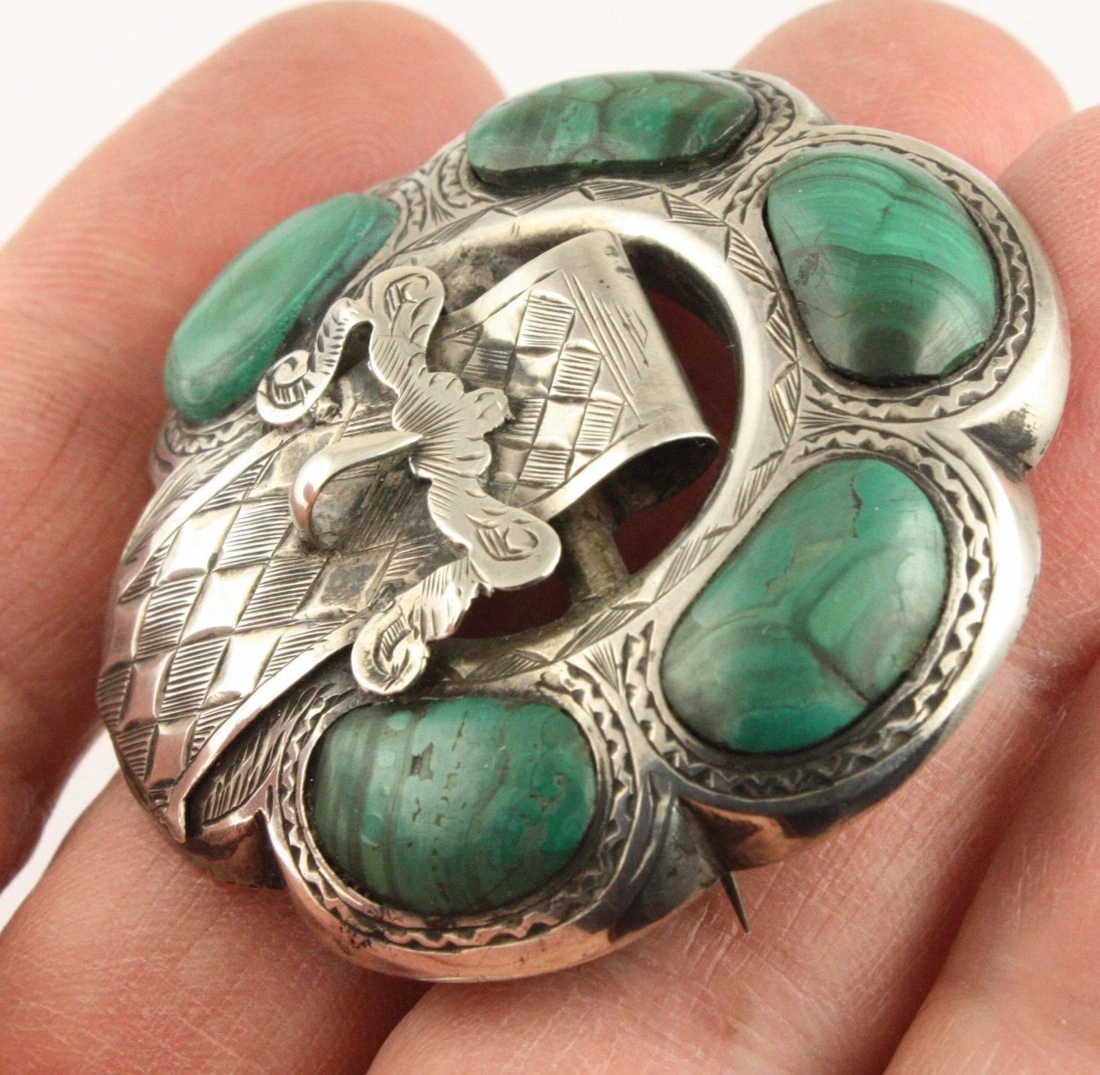 Stunning large Victorian Antique Malachite Sterling Silver Scottish Garter Brooch Circa 1890; C clasp and pin are in excellent working condition; fully tested and is sterling silver. During Queen Victoria’s reign Scottish craftsmen used many