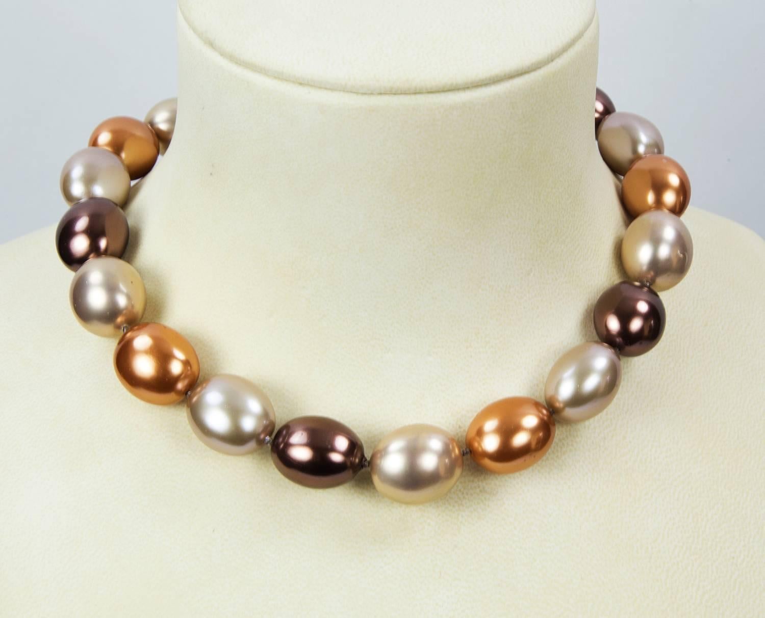 Best quality of faux Tahitian South Sea oval Pearls in unique exotic colors and shades; hand strung and knotted with matching colored silk!  Strand measures approx. 18