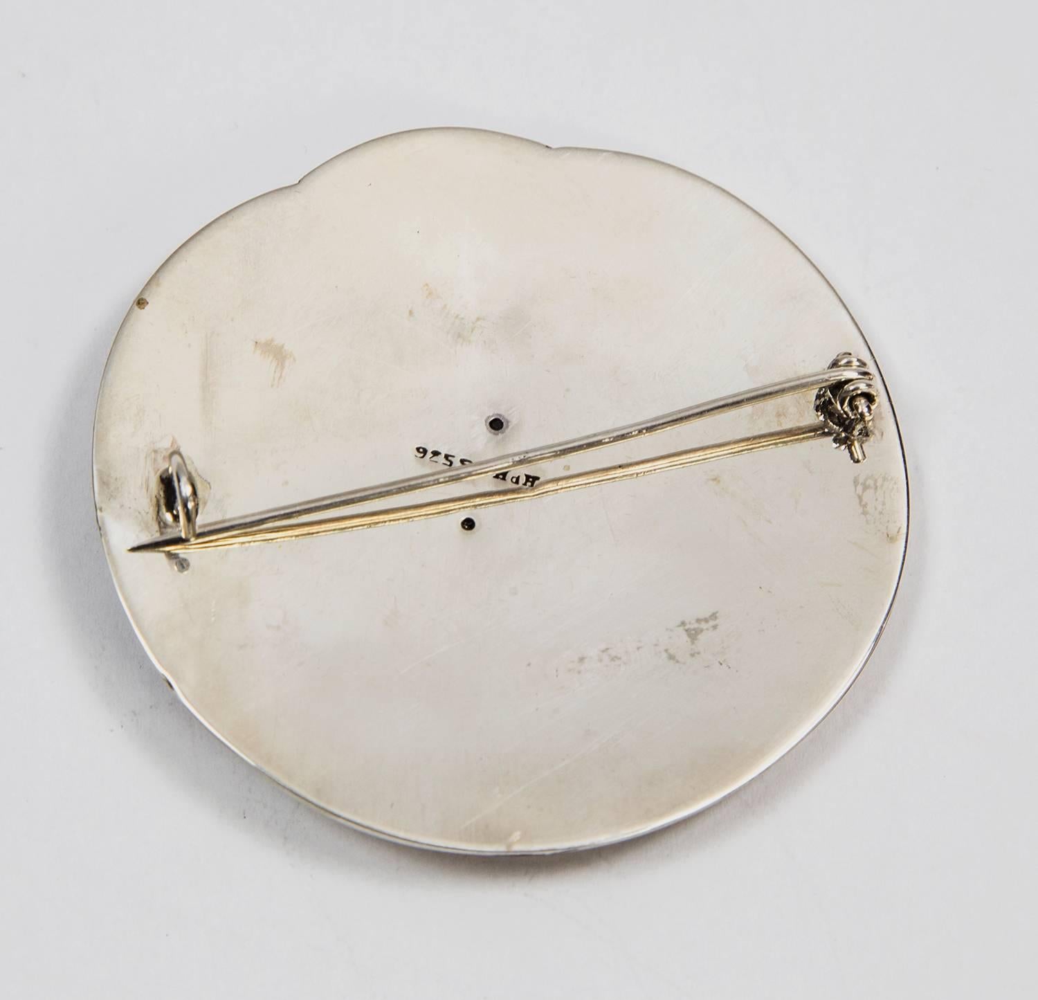 Avant Garde and Fabulous Hand Hammered Circular Brooch designed by Hans Hansen of Denmark (1884-1940) c1930s; measuring approx. 2.40” in diameter; marked: HdH 925S. In original box; Highly Collectible, Chic and Timeless…the perfect gift for that