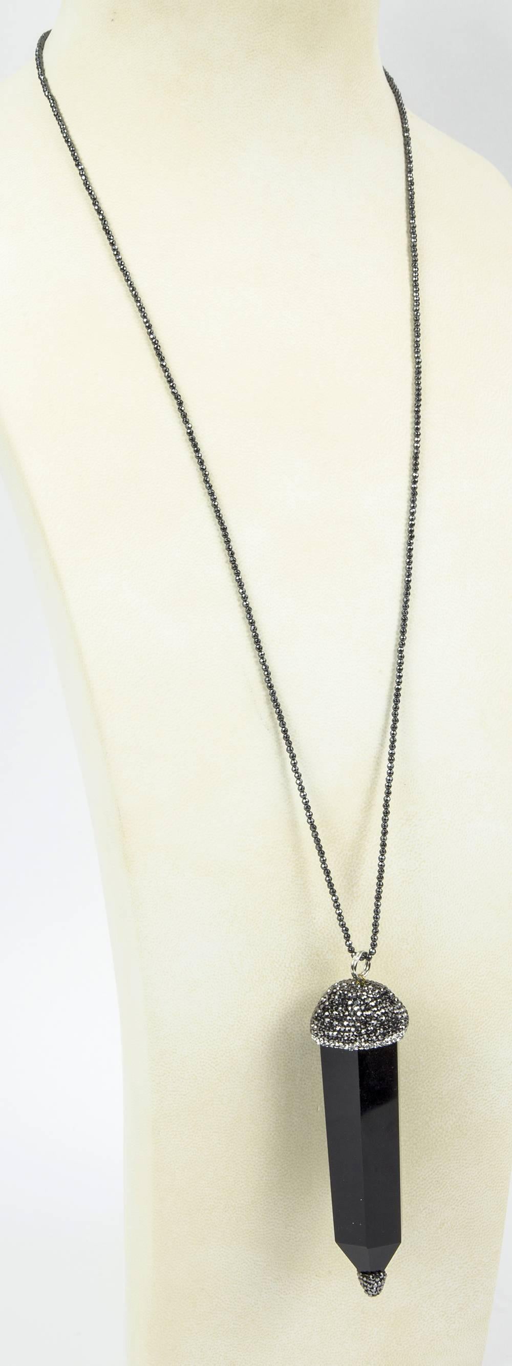 Exquisite Deco-inspired drop necklace, featuring an elongated faceted Onyx Crystal silhouette pendant embellished with sparkling pave set Hematite and CZ top and bottom, suspended from a hematite necklace approx.  32
