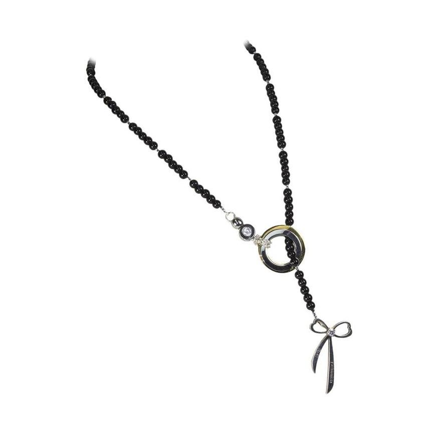 Halskette aus Edelstahl mit Herzanmerkung aus Sterlingsilber und Onyx (Rundschliff) im Angebot