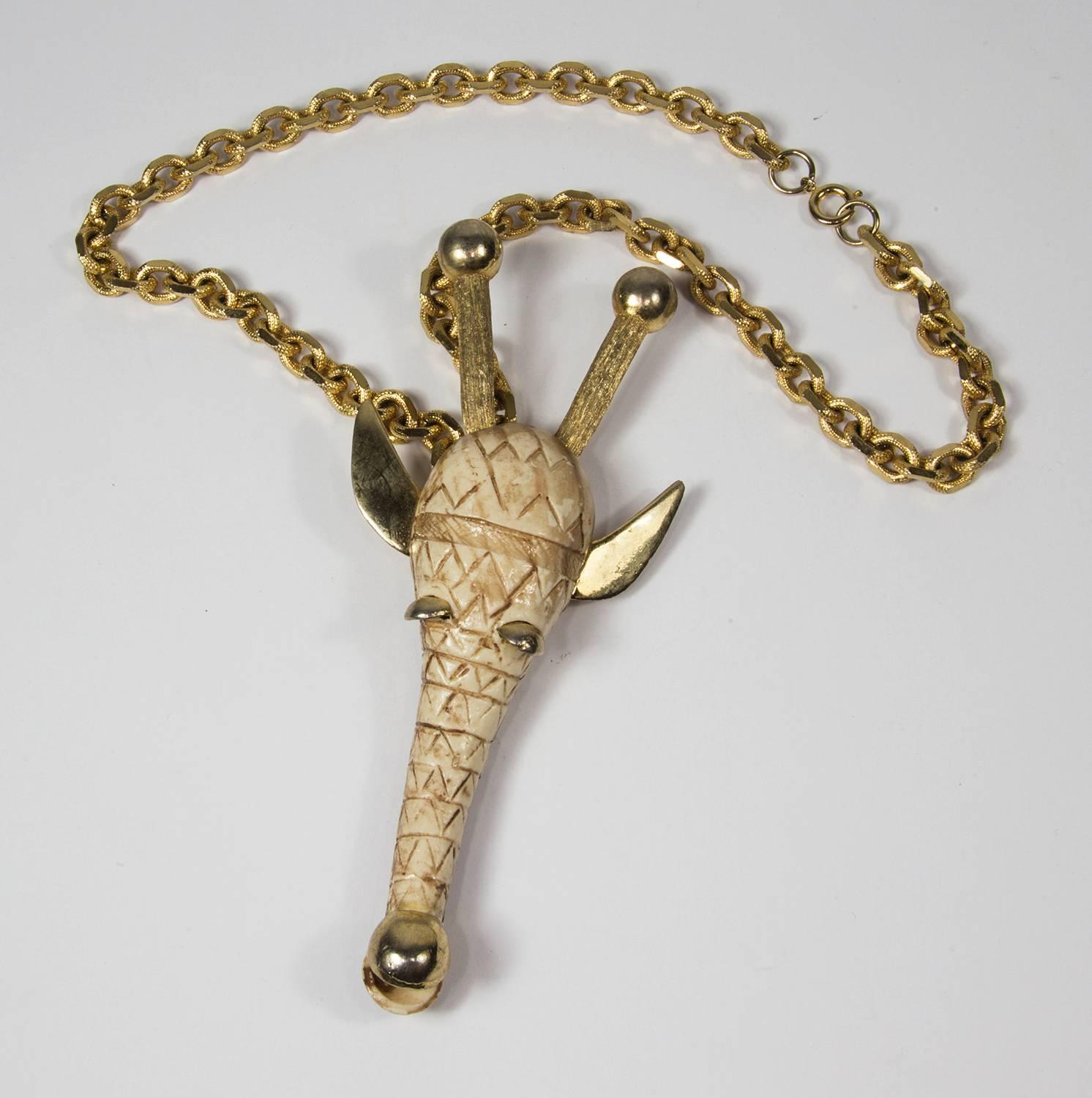 Fabulous unsigned Razza Zodiac Pendant featuring the sign of the Giraffe, crafted by famed Iconic designer Luka Razza; the giraffe’s face is cast of ivory resin and is backed by gold-tone metal; Giraffe’s horns, ears and eyes are also of gold-tone