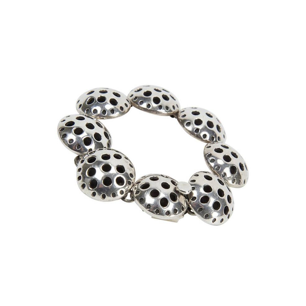 Beautifully crafted sterling silver linked chain bracelet featuring a design of circles within a circle with interior oxidation; marked: 925 MEXICO; measuring approx. 6.75” long; 62.6gm; Chic and Timeless! Circa 1950s