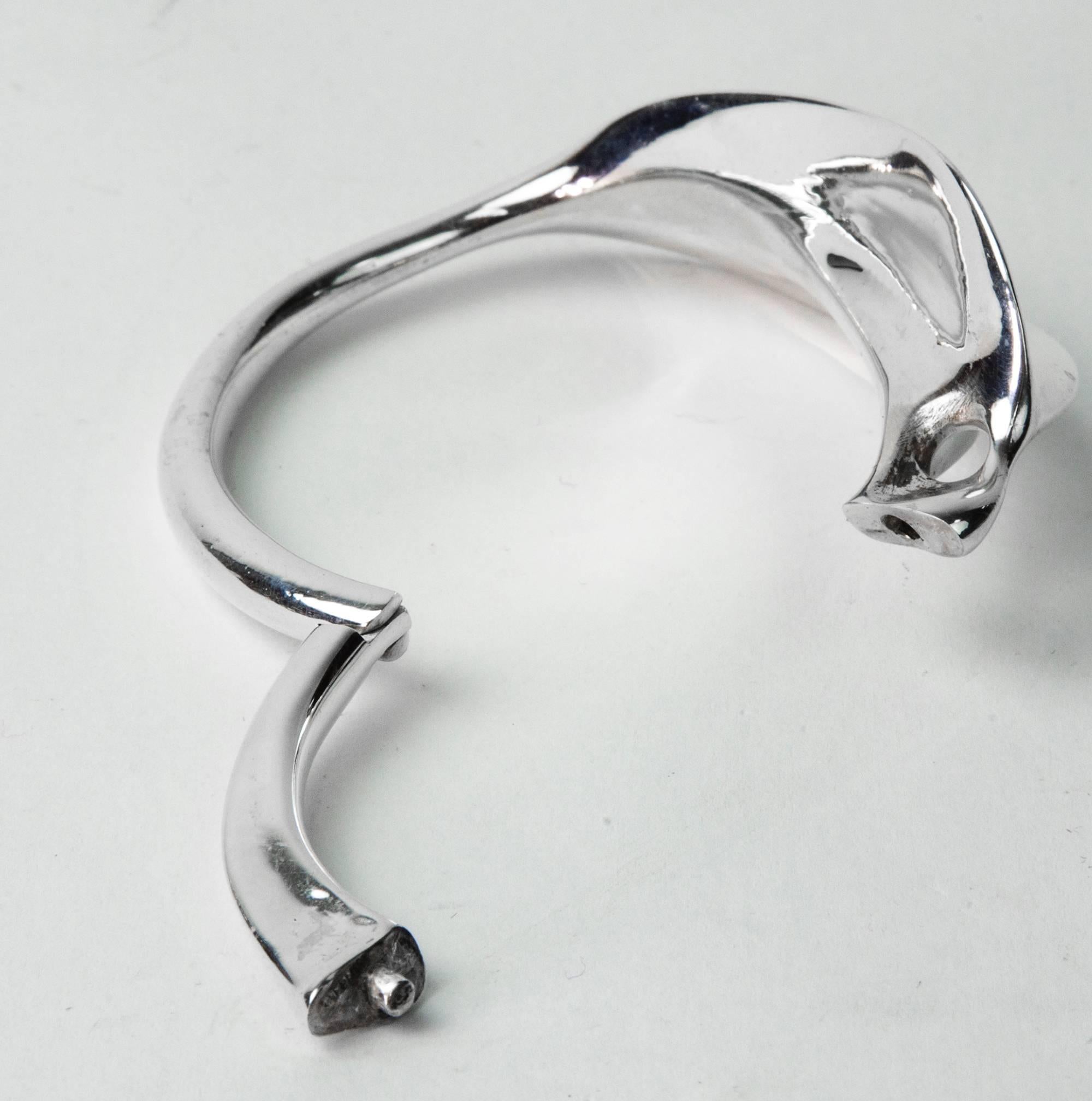 Vintage modernist sterling silver bracelet hand made in beautiful  free form organic design. The hidden clasp holds securely. Fits small to medium wrist.