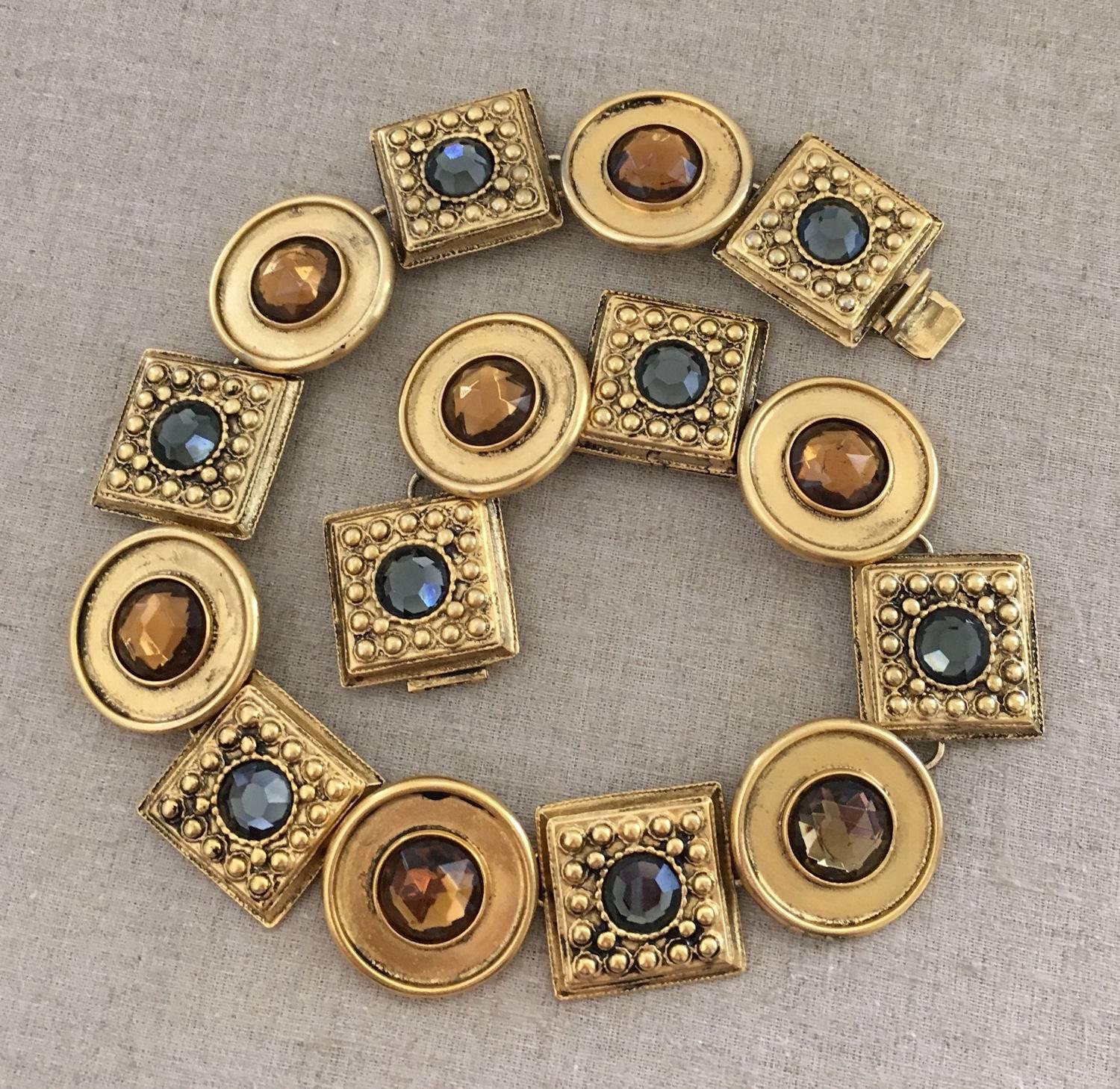 Fabulous Ben-Amun signed statement necklace. Collar length with alternating square and round links; Square links have a textured design with blue/gray facet accents and the round links have faux amber facet stone accents. Metal has an aged gold with