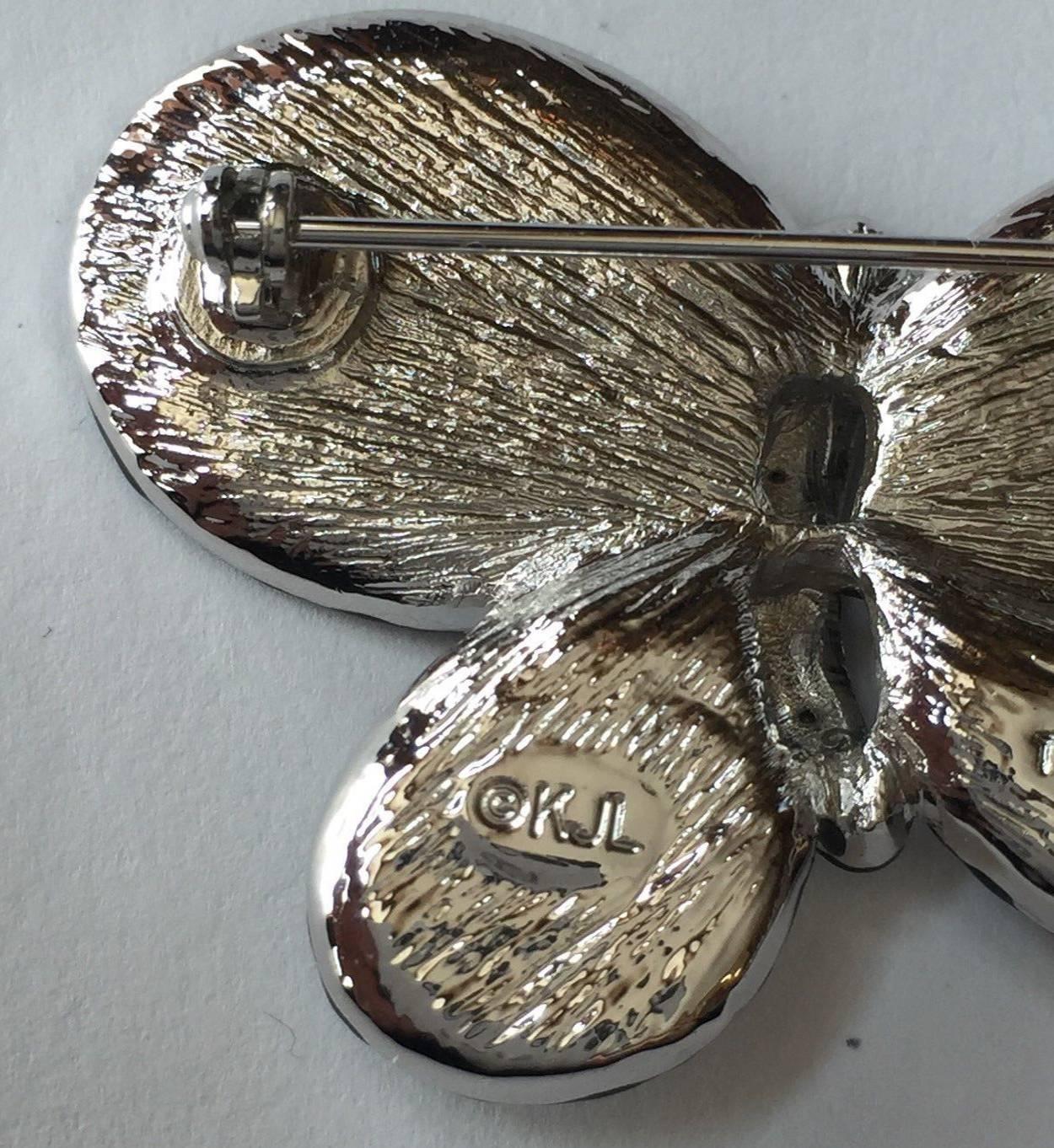 Beautiful Kenneth Jay Lane Mariposa Butterfly silver tone Brooch set with CZ Crystals; Black Enamel detailing;  signed on reverse: KJL;  approx. size:  just under 1.75