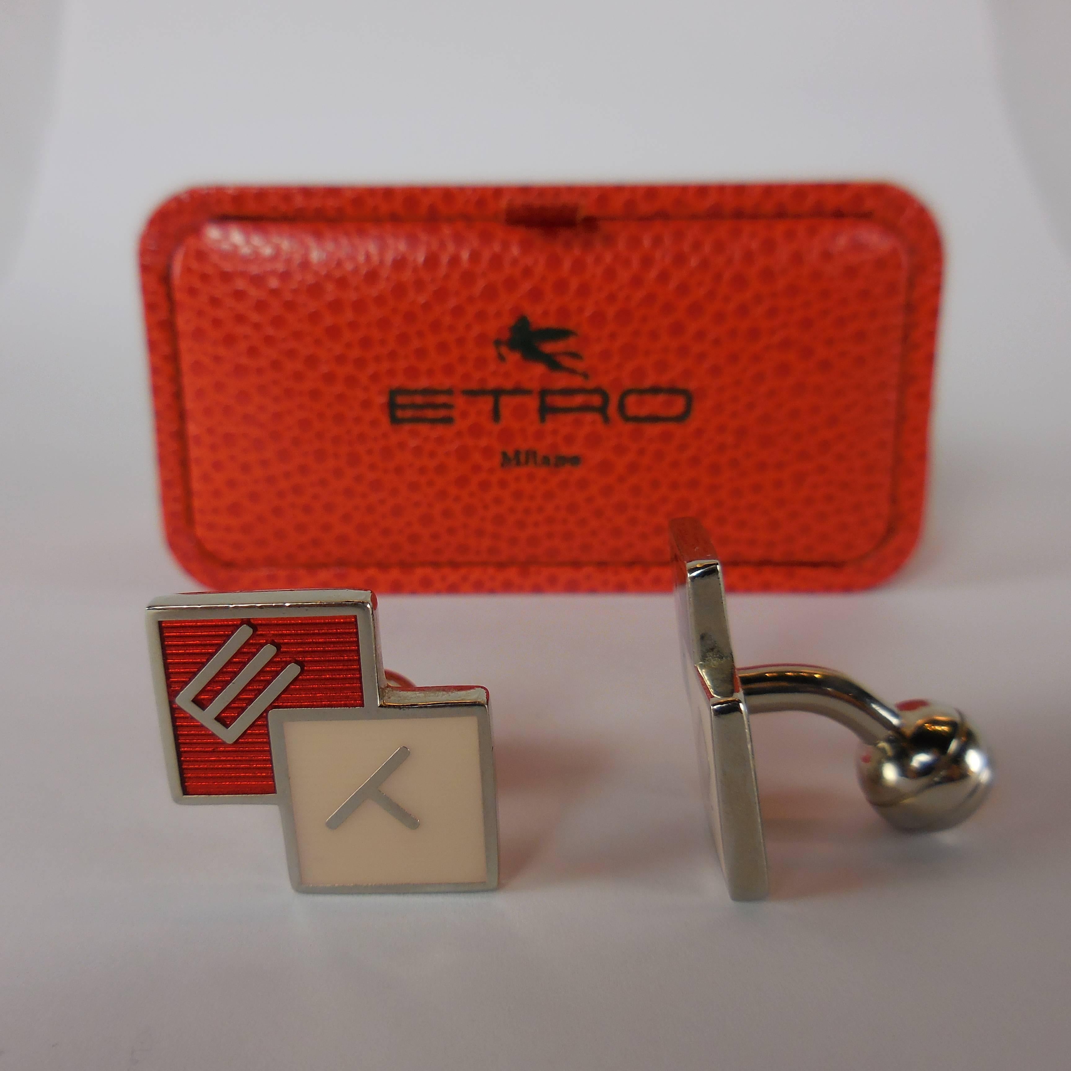 Pair of signature ETRO Milano red, black, and ivory enameled and gold color  cufflinks with ball fasteners each embossed with E.
Signature presentation box included.