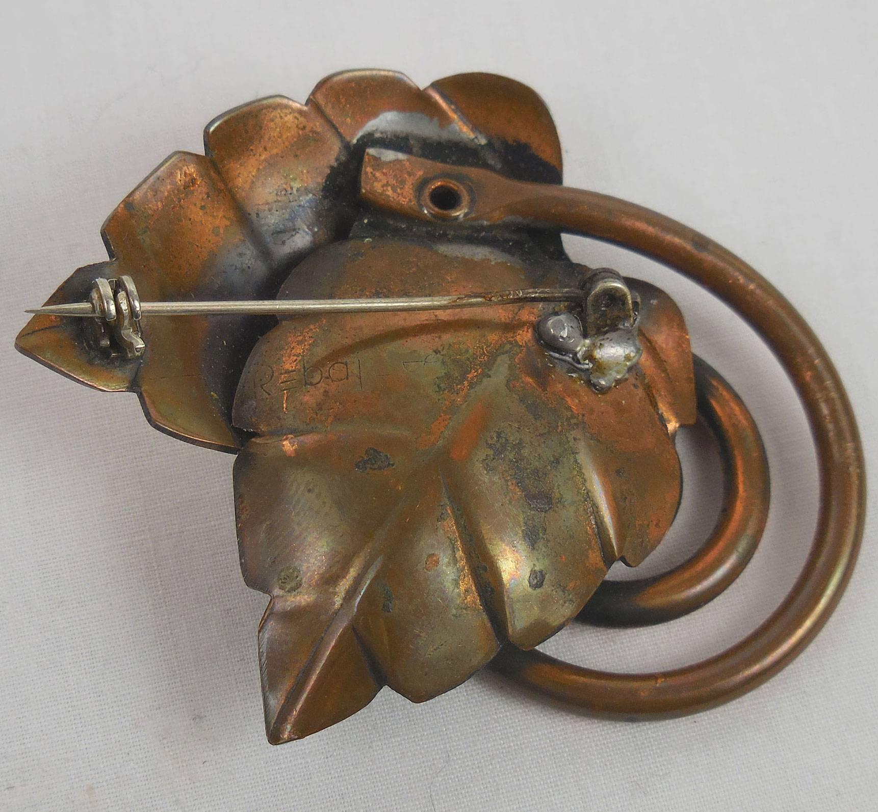Modernist brooch pin modeled as a pair of patinated copper leaves on coiled stem, by modernist New York master, Francisco Rebajes: signed to reverse. Classic and Chic...Add your own Style and Pizzazz to any outfit!