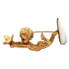 Vintage Cherub Holding a Dove Pearl and Sapphire Gold Brooch Pin