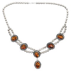 Vintage-Halskette im Stil der amerikanischen Ureinwohner aus Bernstein und Sterlingsilber mit Navajo-Motiv „Squash Blossom“