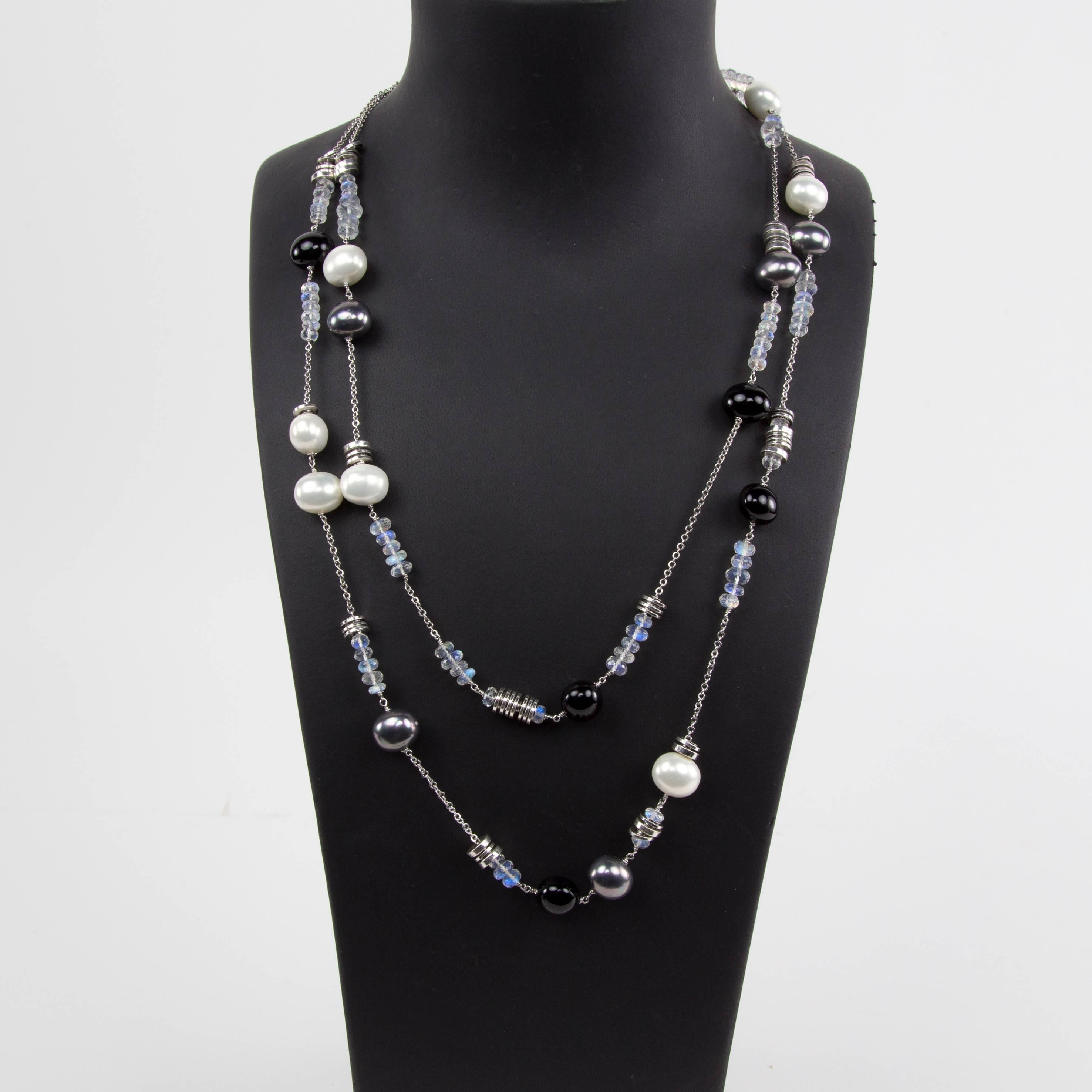 Long Chic black, gray and white Faux Pearl Statement Necklace inter-spaced with facet opalescent crystal and silver Beads on Sterling Silver chain; A Striking 58 inches long! Circa 1980s. A perfect complement to every wardrobe…Illuminating your Look