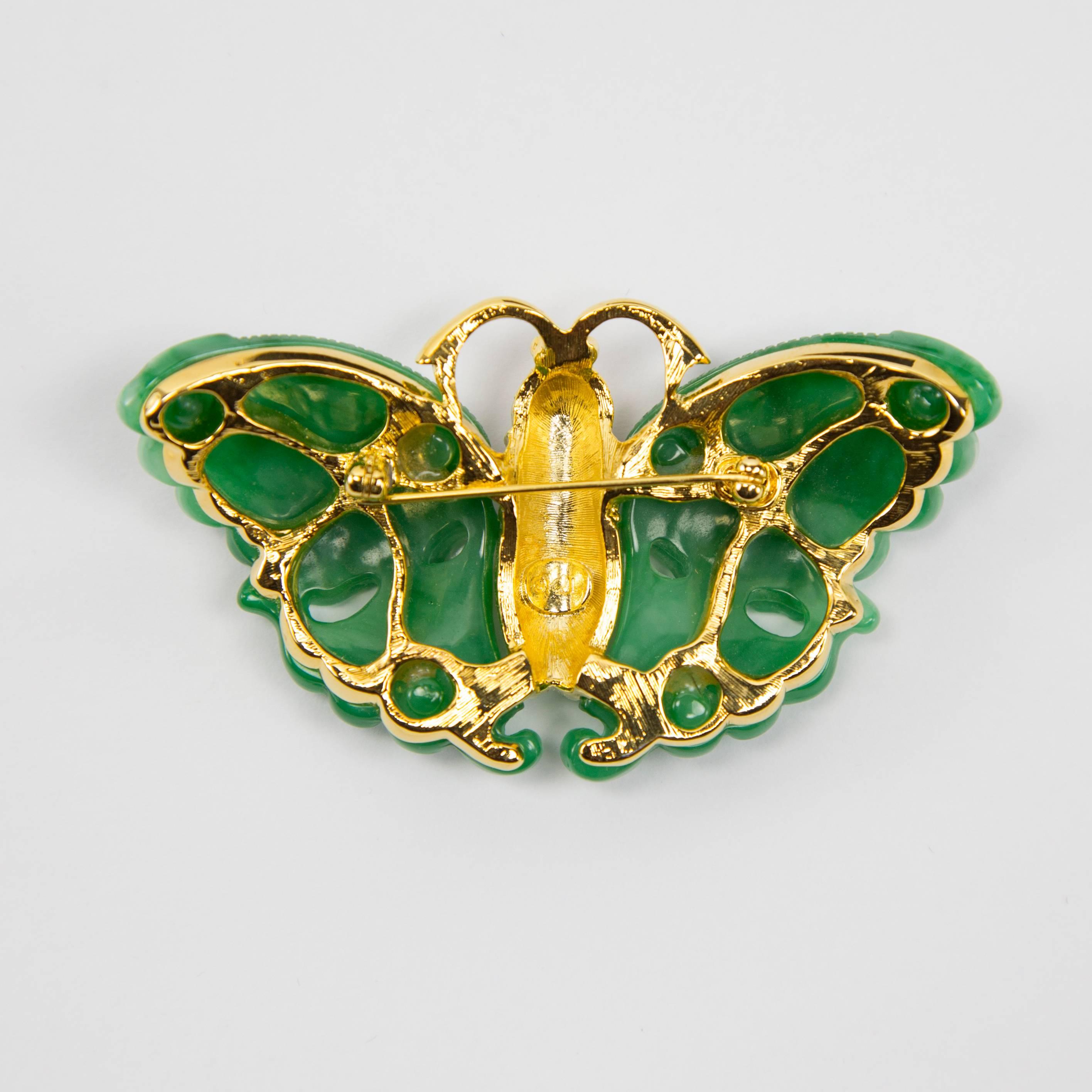 Beautiful signed Kenneth Jay Lane Large Butterfly Brooch featuring ornate Faux green Jade wings, Coral enameled body Pave set with Faux Diamonds; marked on reverse: KJL; measures approx. 3