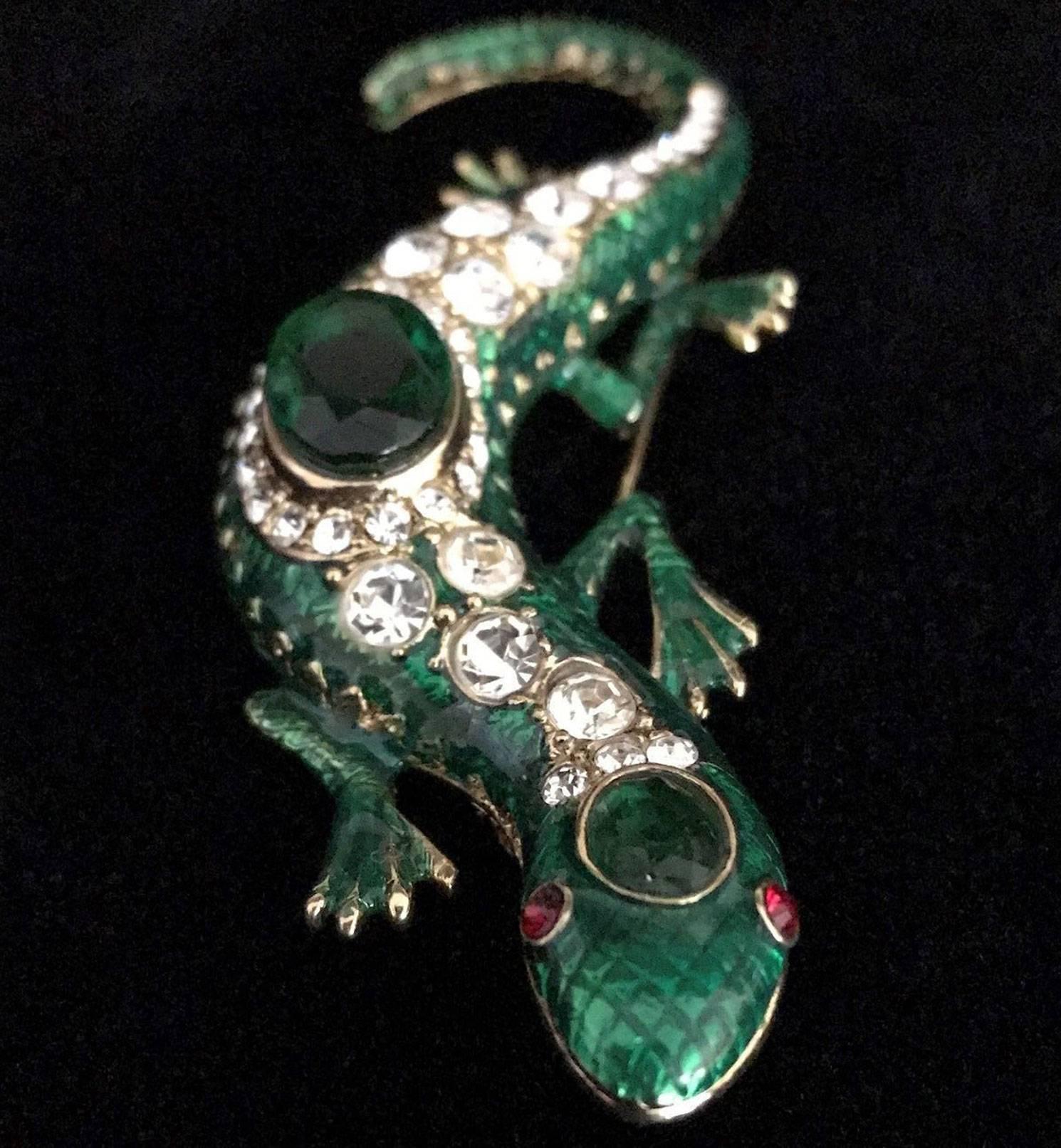 Striking signed Kenneth Lane (KJL) Salamander Statement Brooch featuring a scampering Salamander; rich green enamel body set with a row of pave set sparkling Faux Diamonds and large Faux Green Emerald Gemstones; eyes set with faux red Rubies;