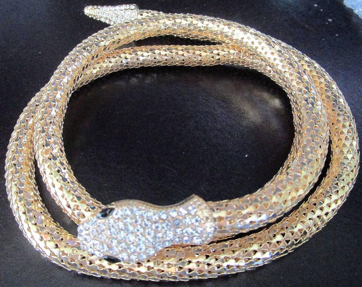 Beautiful Golden Mesh Snake Runway Necklace with Sparkling Rhinestone encrusted snake head and tail;  a magnet under the head, so versatile, allowing you to worn in many different ways; even as a belt. A Chic and Striking Show Stopper… Illuminating