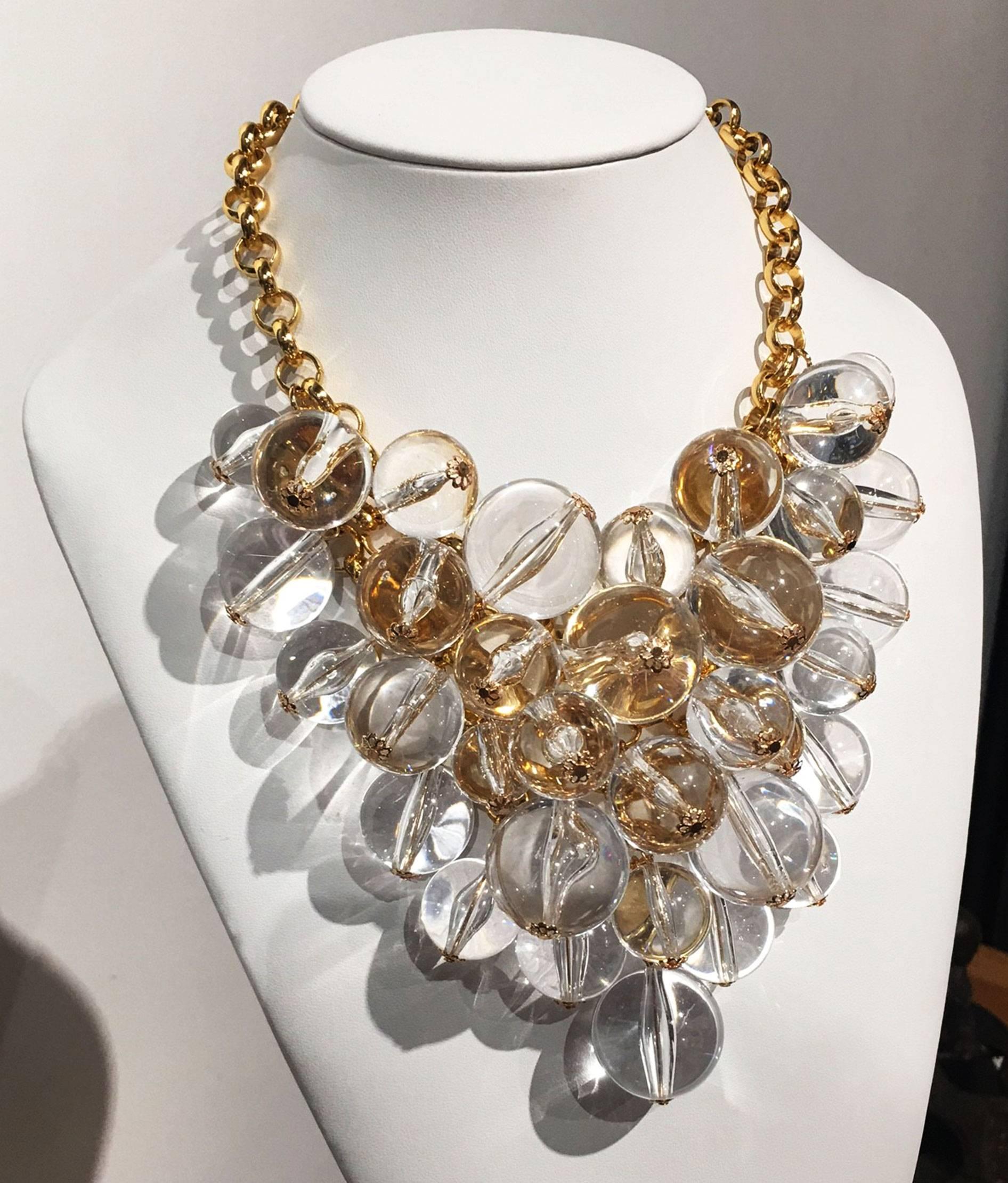Sensational signed COURREGES PARIS Couture Festoon Lucite Pools Of Light Runway Necklace; Gold Tone; It has a round tag marked 