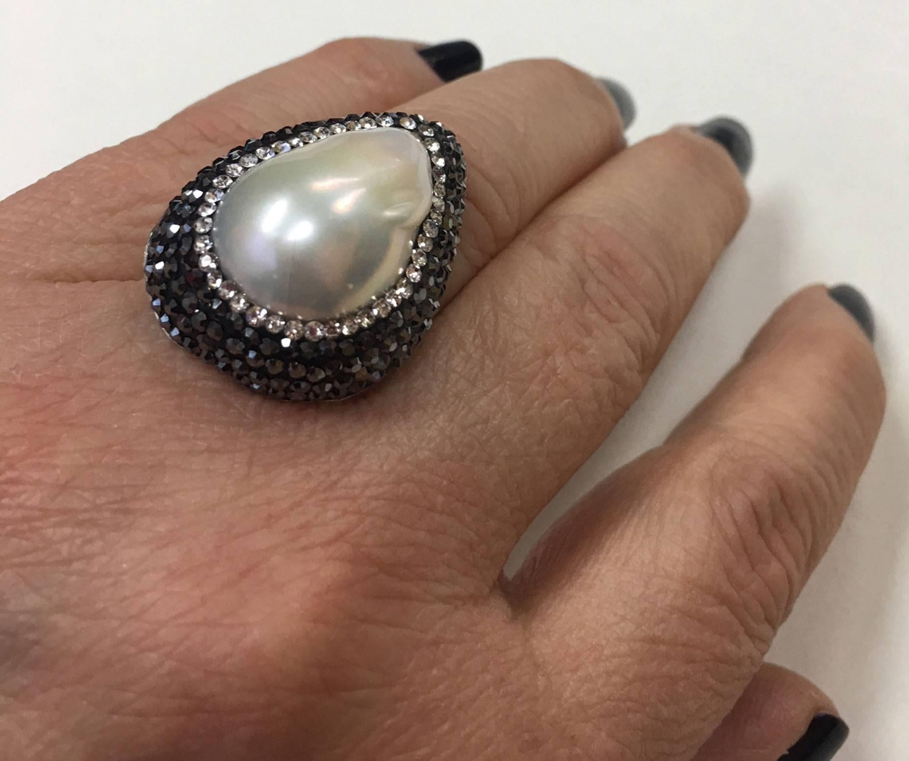 Sparkling pavé-set Faux White and Black Diamonds bring out the breathtaking Beauty of this Teardrop Mobe Pearl Runway Ring. Marked: 925; Size 8; approx. measurement of top 32mm x 23.5mm (at widest point). Chic and Timeless...Illuminating your Look