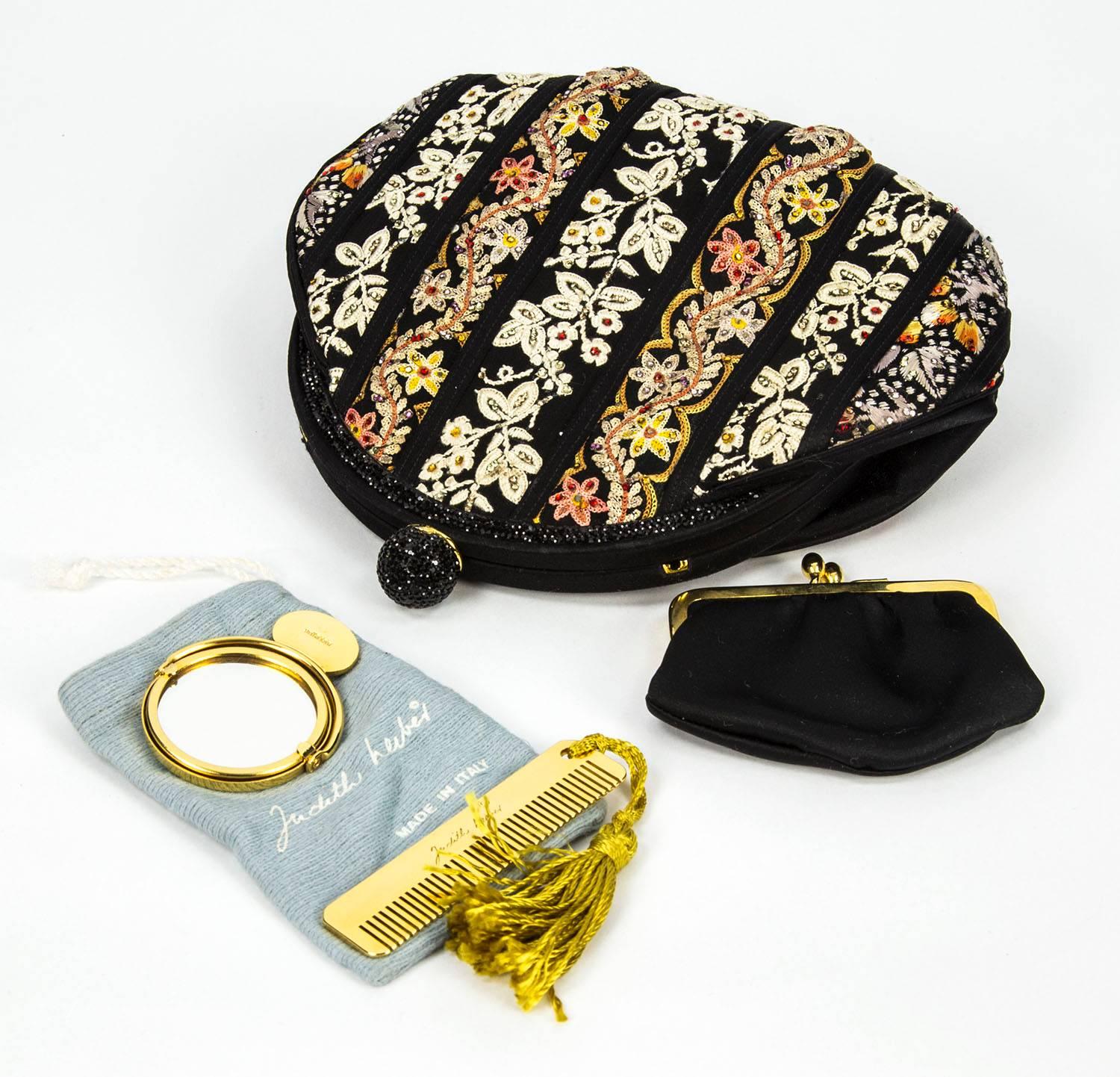 Beautiful Judith One-of-a-Kind Judith Leiber Antique floral design Ribbon Black with Multi Crystals Evening Bag; can be carried as a shoulder bag or straps can be tucked inside for a clutch. Comes with comb, mirror, coin purse and Logo dust bag. Add