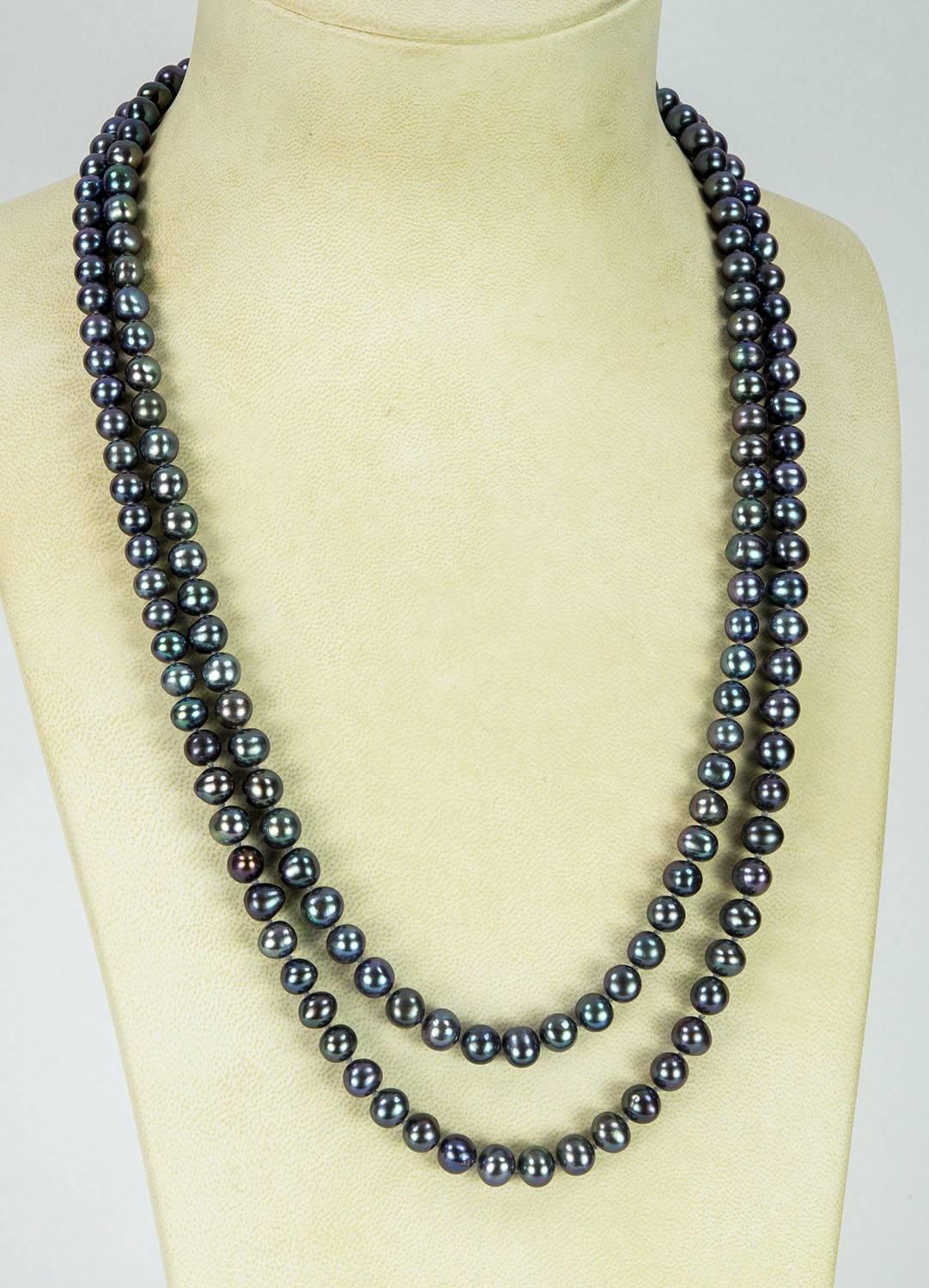 Striking lustrous 7.5-8mm Silver/Grey Freshwater Pearl Necklace, hand knotted with matching color silk thread, Necklace measures approx. 54” long. Go anywhere in style with this Chic and Timeless taking you from Day to Evening!