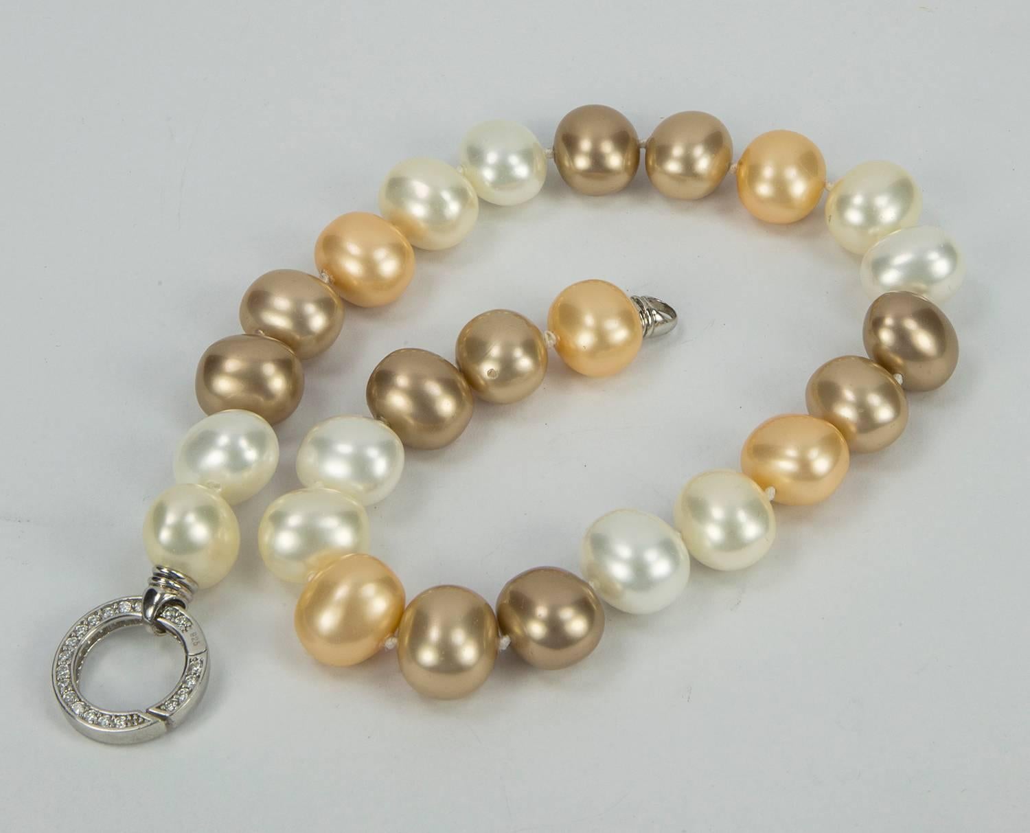 Stunning Lustrous White, Gold and Bronze semi-round Faux Pearl Statement Necklace; Each Luscious Pearl measuring approx 18.5mm x 16mm; hand knotted with matching color silk thread; held by a round CZ encrusted clasp; approx 18.5” long. Chic and