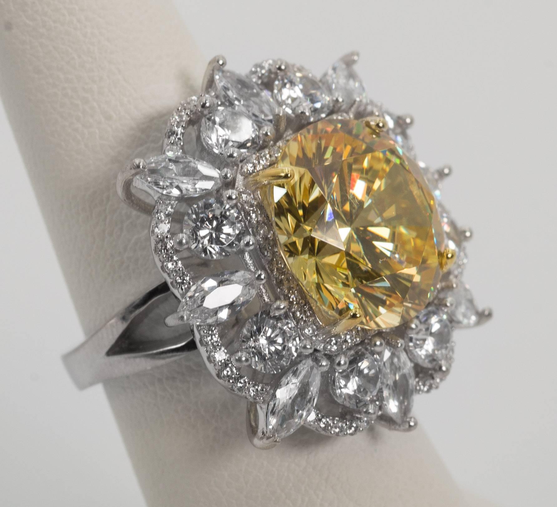 A 15 carat fancy intense canary yellow hand special cut round cubic zirconia nestled amongst fancy cut white faux diamonds set in sterling designed to the highest fine standards possible. A classic amazing sparkly and brilliant look that will last