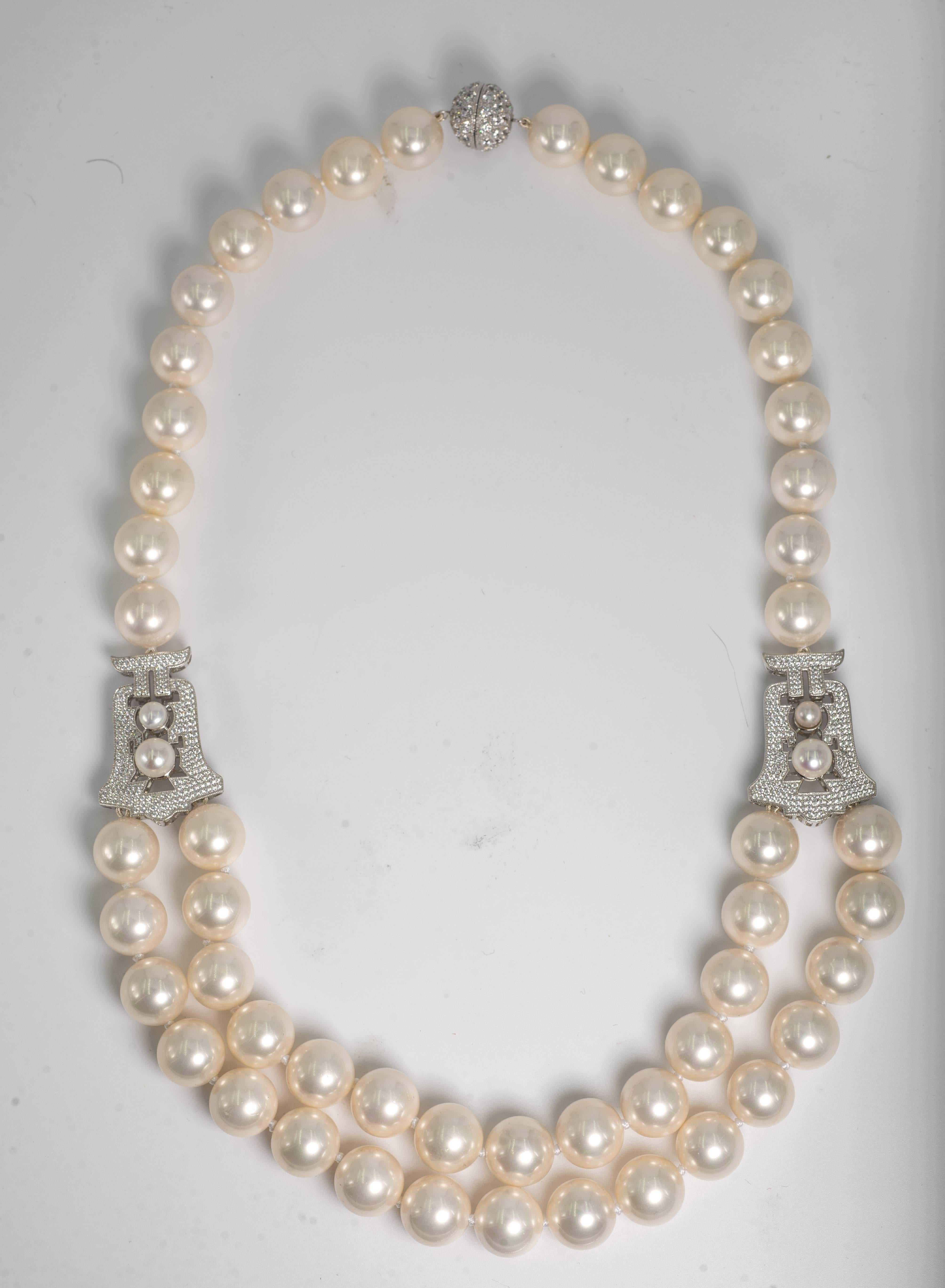 Elegant classic Audrey Hepburn Style one row14 mm pearls  at the back, side pave cubic zirconia sterling motifs suspending two rows of 14mm pearls for the front. The Art Deco style pave motifs  are 1 1/4 inches. Total length 24 inches with a pave