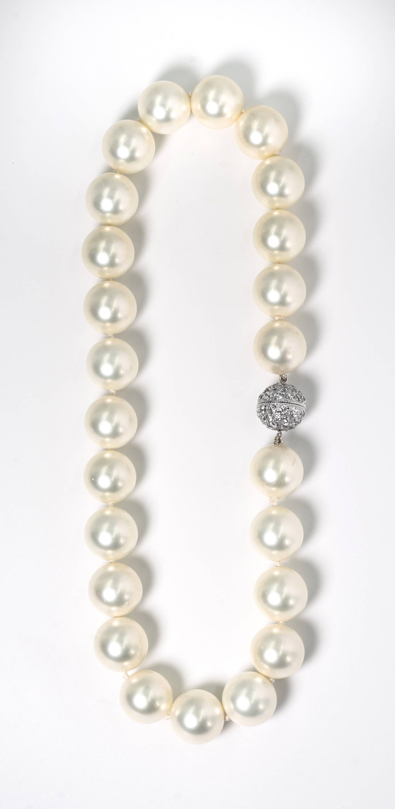 Faux 16mm South Sea Pearl Necklace measuring 17'' to a pave cubic zircon clasp. The pearls are made of mother of pearl and have  a wonderful luminescent pearl coating.