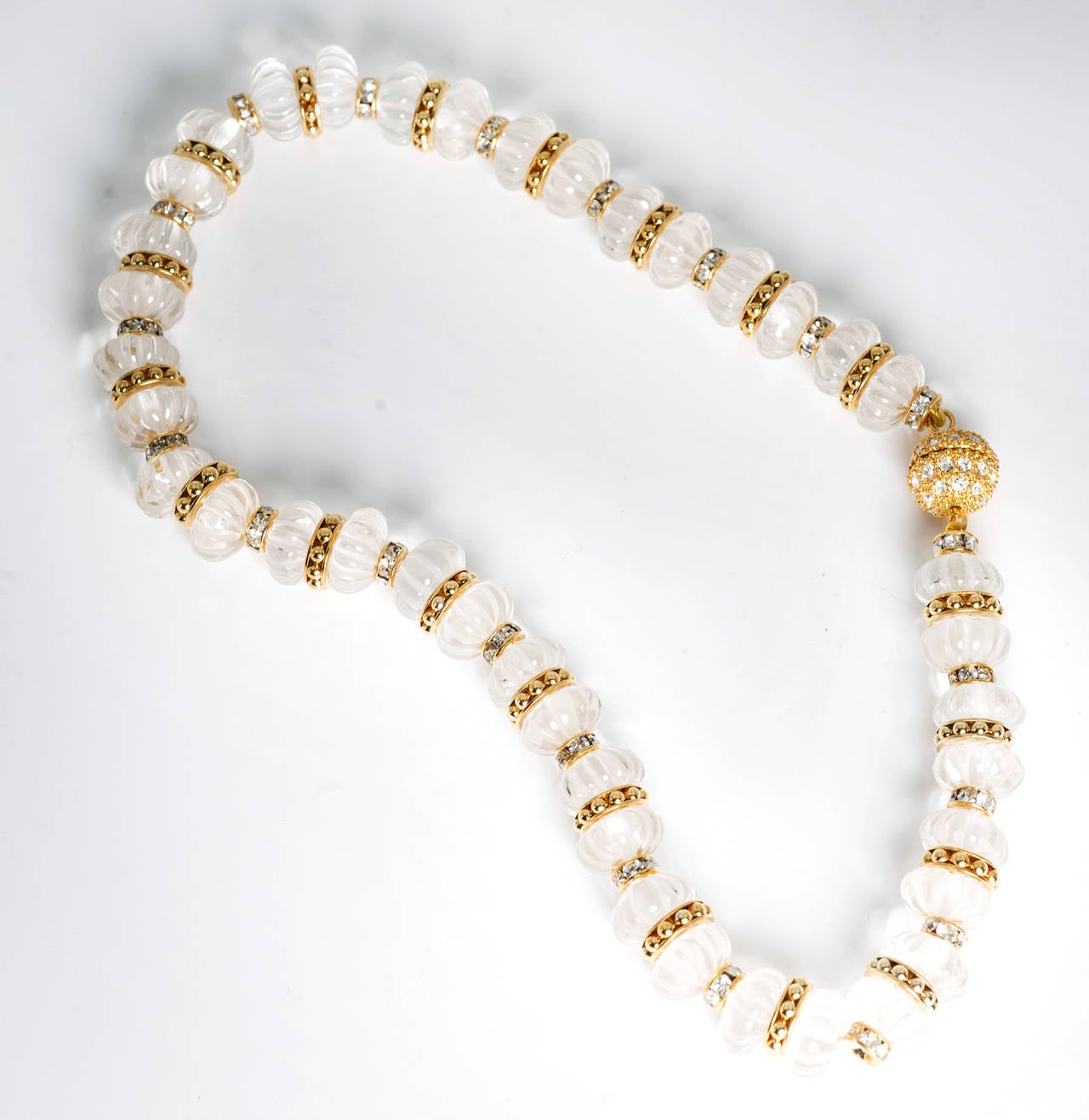 Elegant real fluted rock crystal beads strung with gilt rondels and Swarovski crystal set rondels. Charming and pretty 10mm bead 13'' long choker.