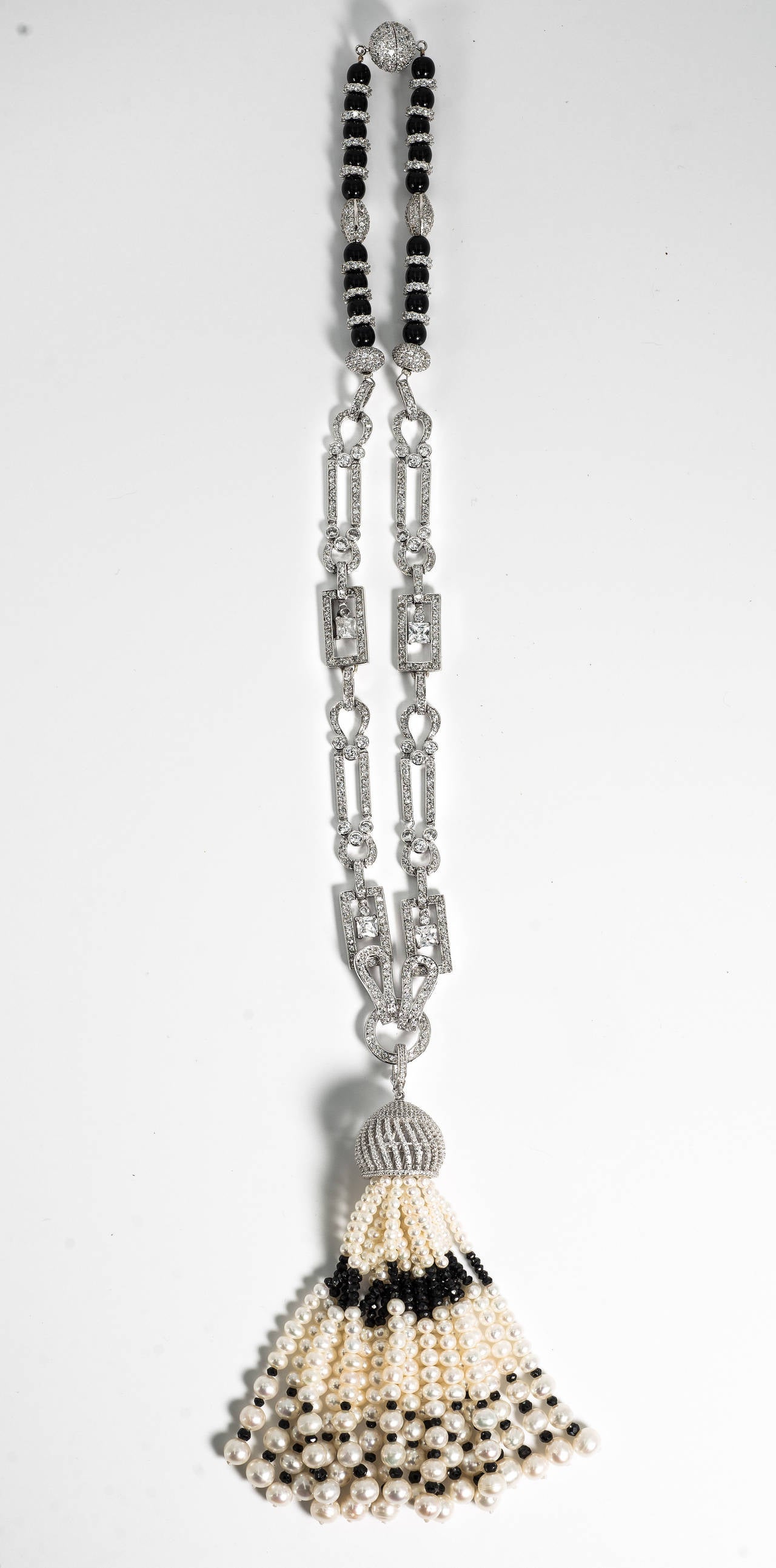 A fabulous combination of real and faux. Real freshwater pearls and onyx tassel hanging from a micro pave cubic zircon set dome attached to an incredible micro pave cubic zircon sterling link chain, totally one of a kind, suspended from an onyx and
