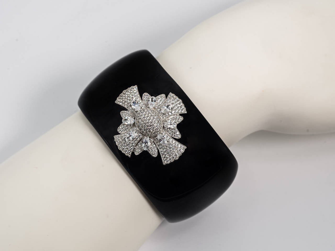 Pave faux diamond cubic zircon set sterling Maltese Cross real black onyx bangle cuff so very much in style to-day. A classic first designed by Verdura for Chanel and yet once more enjoying a revival. 

Exclusive and very chic.

The bangle is