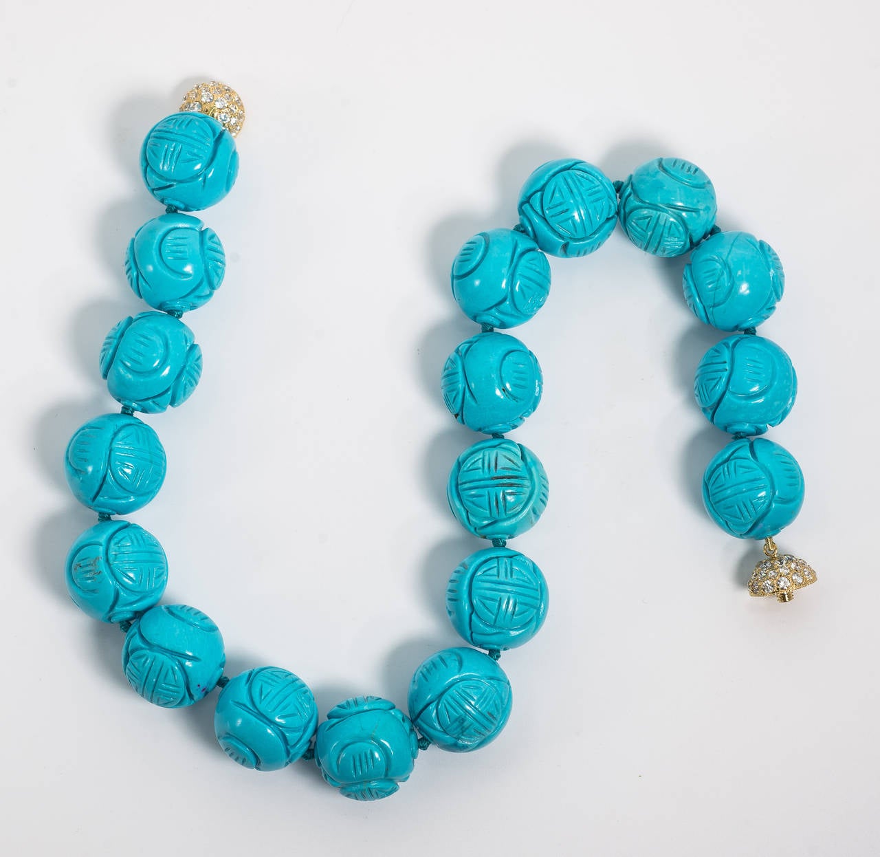 Fabulous large Faux Chinese Good Luck  turquoise 20mm bead necklace hand strung on turquoise silk attached to a pave Cubic Zircon ball clasp. Necklace measures 18'' long. Wonderful color beads.