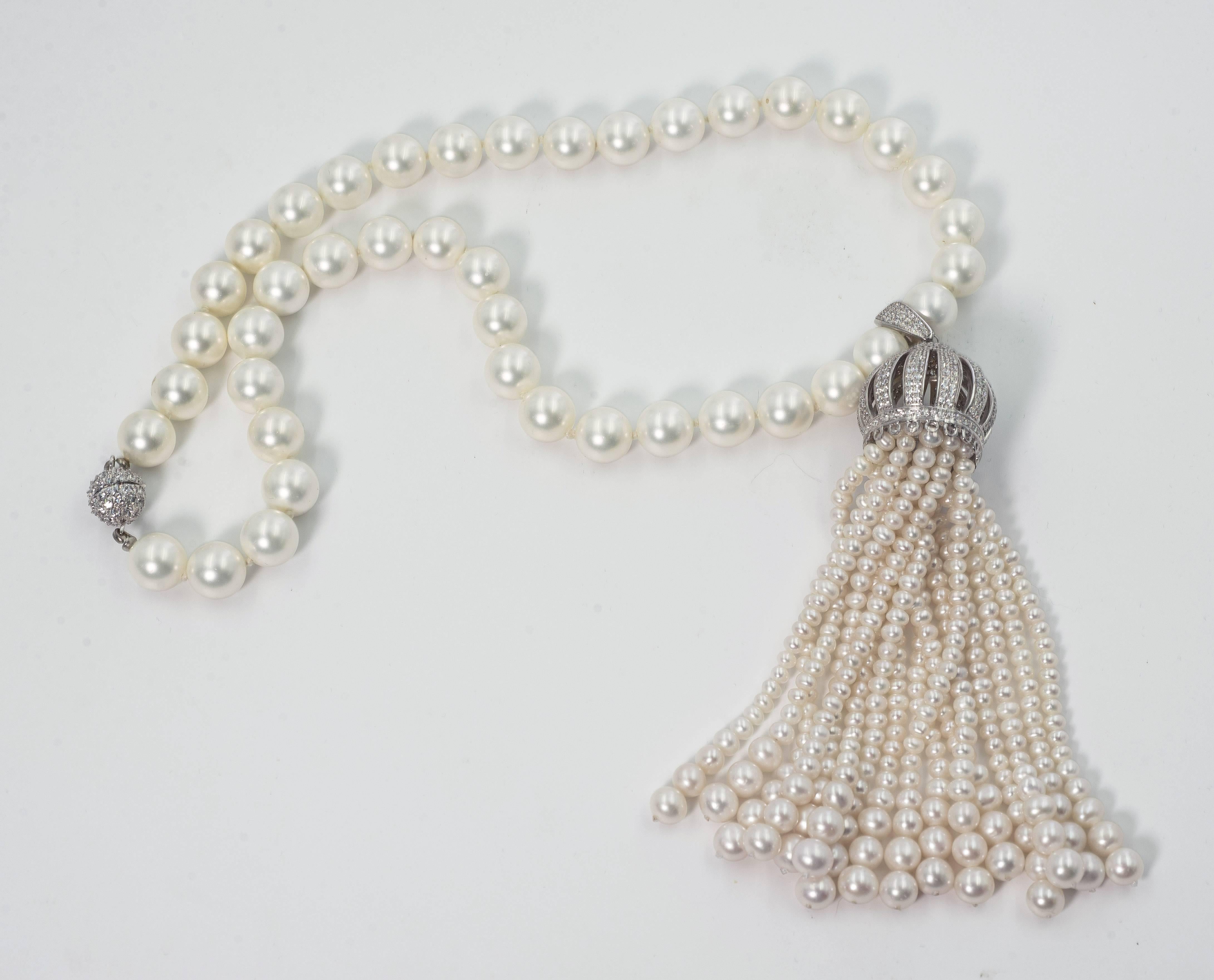 Faux pearl diamond domed tassel necklace of 18'' 10mm pearls suspending a wonderful Edwardian style micro-set pave cubic zircon domed graduated pearl tassel measures 4''. Pave ball clasp. The tassel is detachable which is really wonderful.