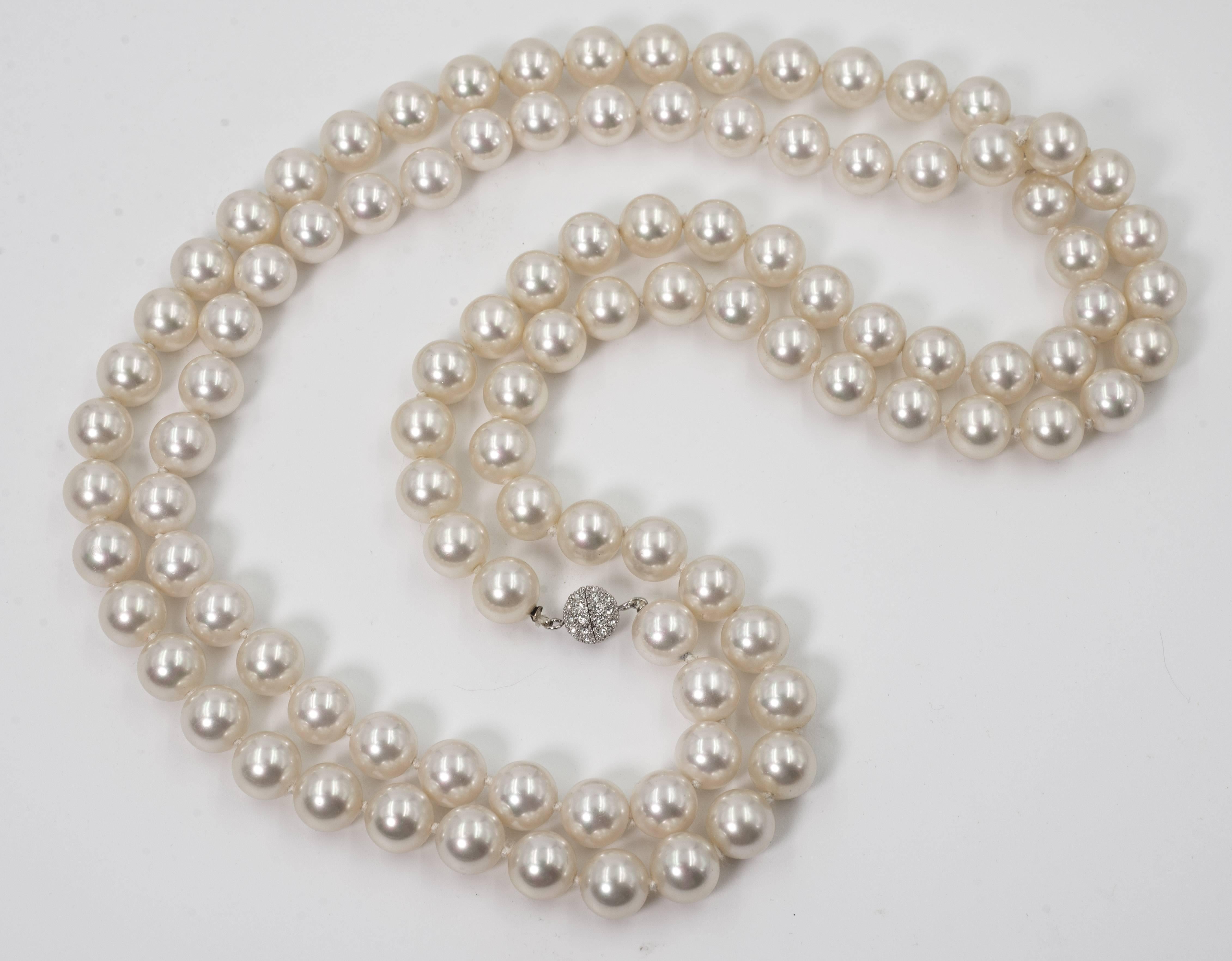 Bergdorf Goodman vintage 54 inch long finest wonderful classic creme faux hand made Japanese glass pearlized pearls no longer made. Pearls measure 12mm attached to pave ball screw clasp. Can be wrapped around as shown two or three times.