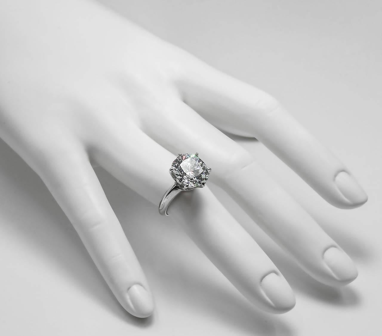 Wonderful brilliant faux antique cushion cut white 5 carat diamond weight ring made of hand cut cubic zircon set in rhodium sterling Tiffany style setting.

Can be sized free of charge to fit.