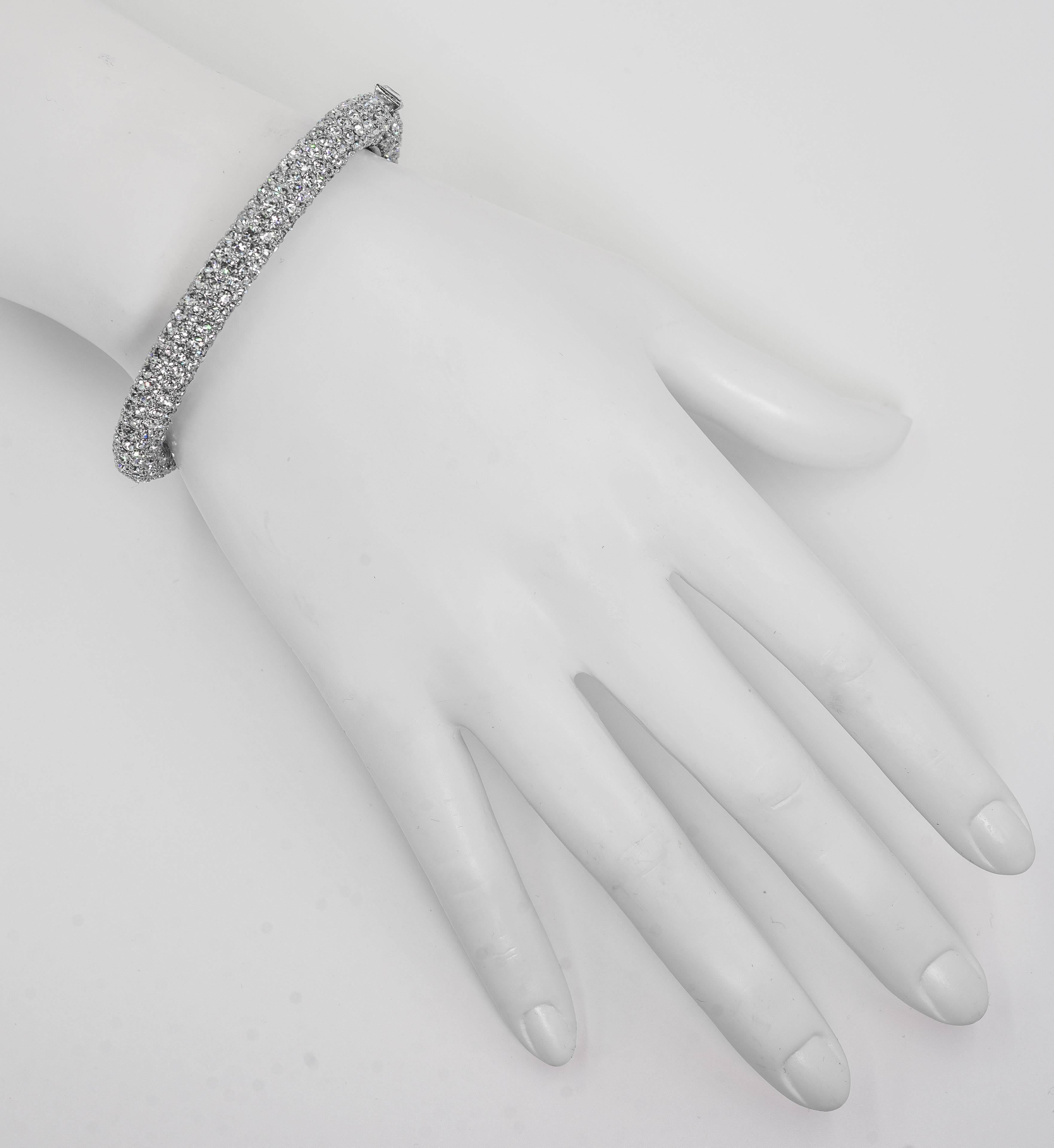 Vintage exclusive for Bergdorf Goodman mint pave Swarovski crystal clasped bangle made for a single exclusive collection in 1994 featured in WWD. Pave all around, thickness of bangle 1/4'' inch and fits up to a 7''wrist. Open and closes, 
secure