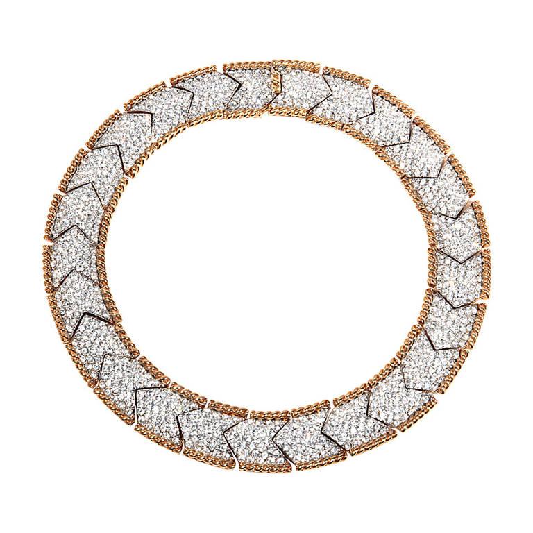 Bergdorf Goodman Vintage One of a Kind Glamorous Pave Crystal Gilt Necklace
Fabulous one of a kind vintage Swarovski crystal set gold rope edged herringbone pattern necklace. The pushpiece clasp is rope pattern.
Signed MCJ for Magnificent Costume