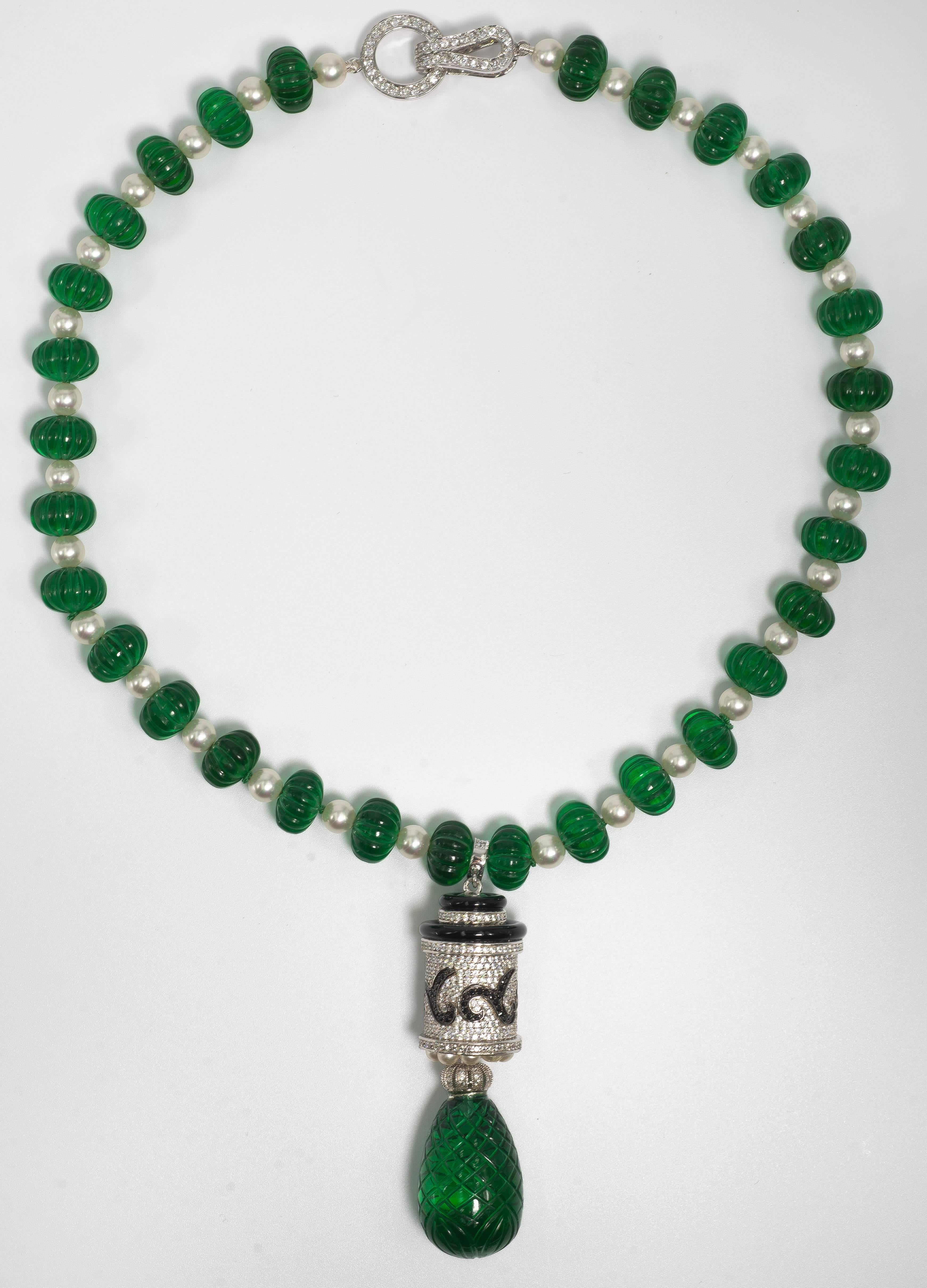 Fabulous Maharajah Jewel Collection carved faux emerald bead diamond necklace made of a strand of hand carved faux emerald beads measuring 16mm  to 12mm each bead interspaced with pearls suspending an Art Deco style faux white and black