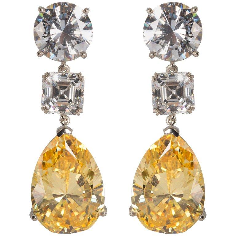 An important amazing pair of  top quality white and yellow cubic zirconia earrings.
Stones so fine and exclusive they deserved to have their own GIA reports.
Each round CZ has the equivalent look of a full brilliant cut 10 carat diamond, a 4 carat