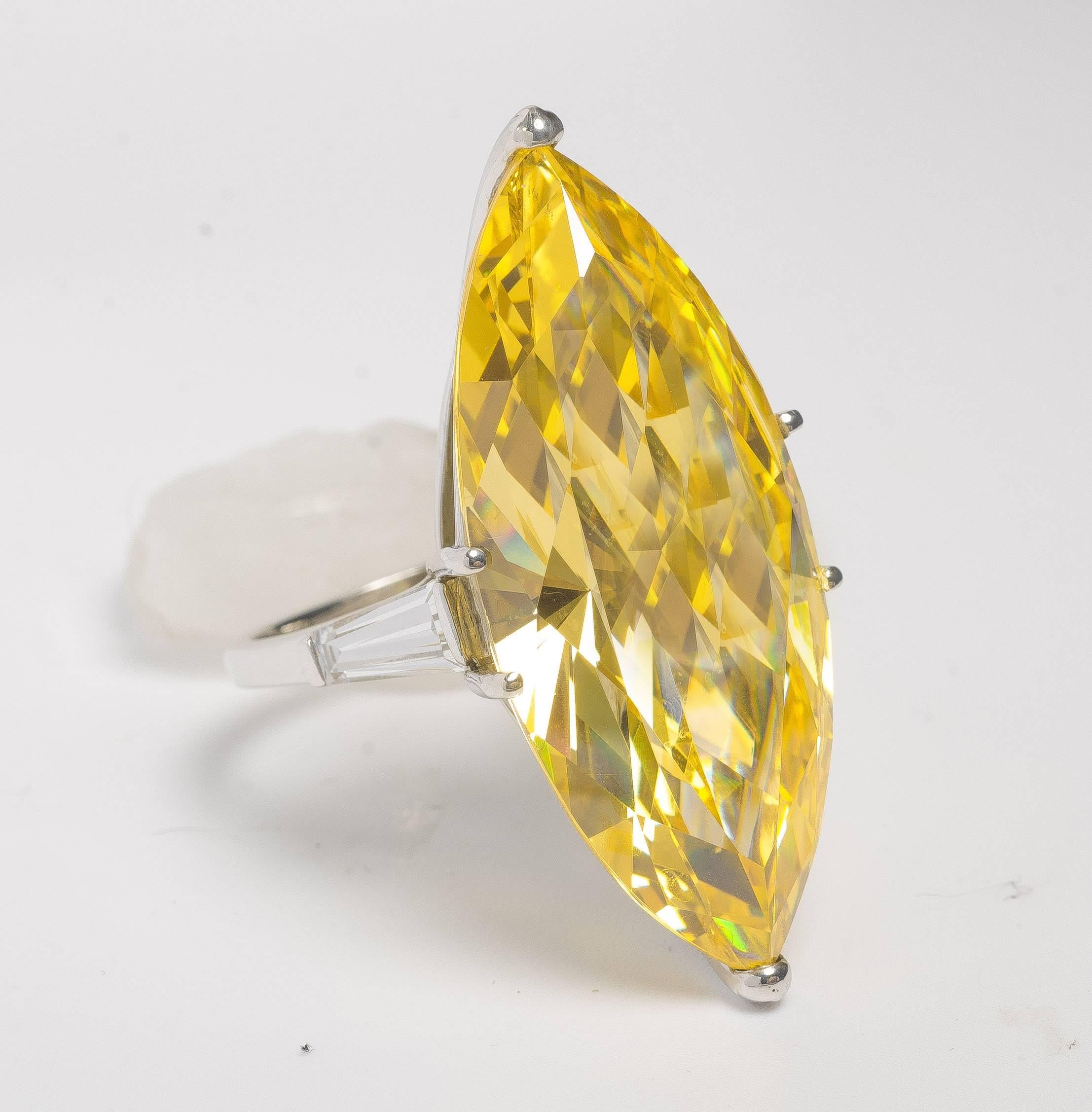 A Fabulous Fake. One for sale here, the other sold at Sotheby's by Daniele Steele that had been bought at Bergdorfs in the 1990s. A copy of the Real One made in canary yellow cubic zircon cut by a NYC diamond cutter. Sides set with tapered CZ