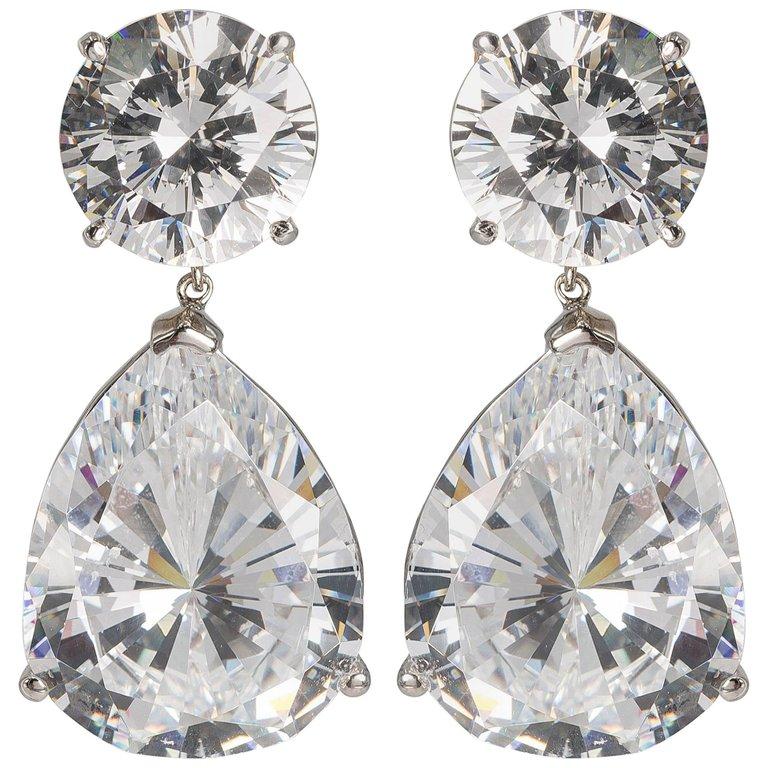 
An important amazing pair of top quality white cubic zirconia earrings.
Stones so fine and exclusive they deserved to have their own GIA reports.
Each round CZ has the equivalent look of a full brilliant cut 10 carat diamond, the pear shapes have